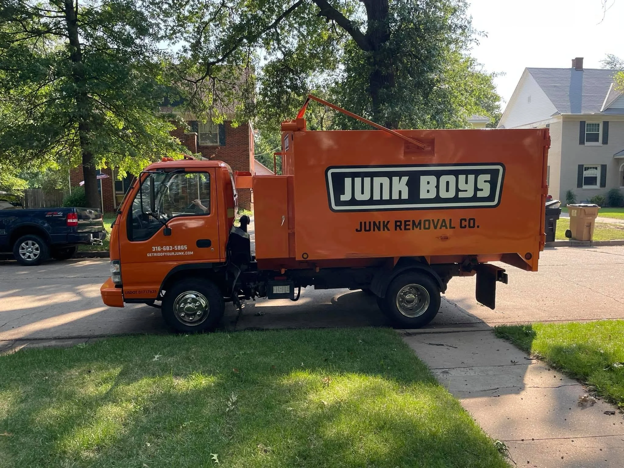 junk boys junk removal truck in neighborhood.jpg