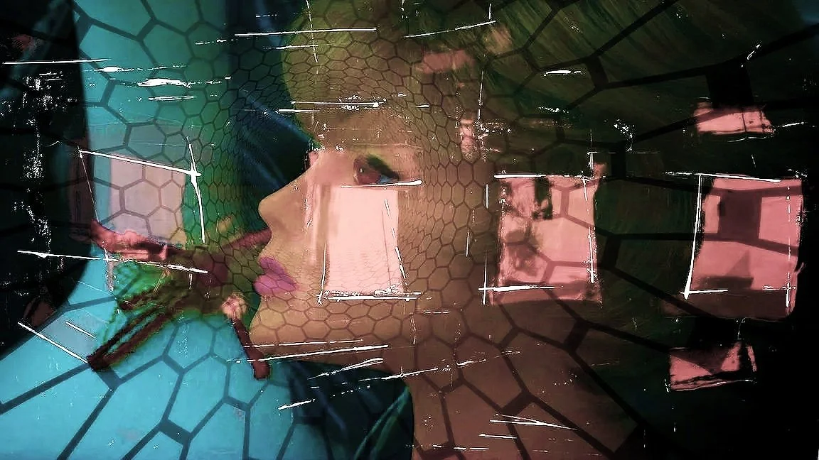 A woman's face reflected in a glass surface with pink and blue lighting, overlaid with hexagonal and square grid patterns.