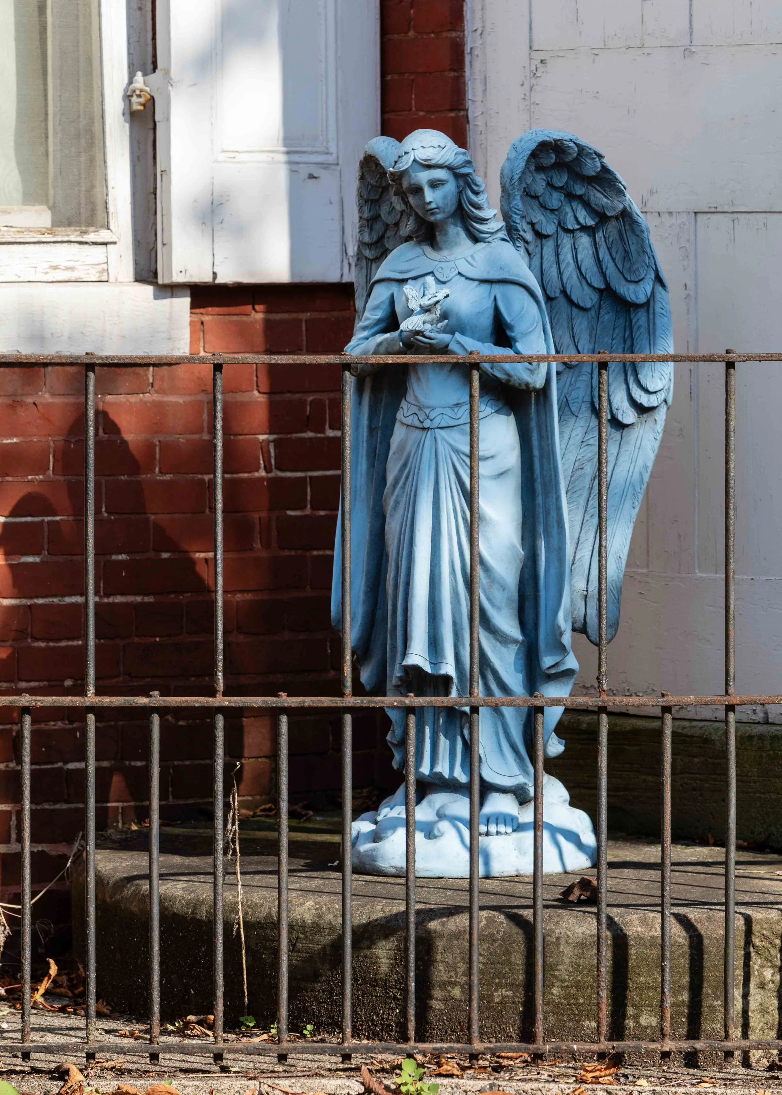 Bllue angel statue on steps, Lewistown, Pennsylvania