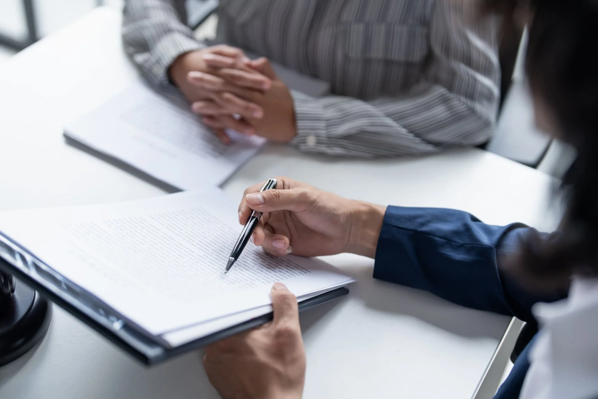 A financial advisor going over paperwork with a client
