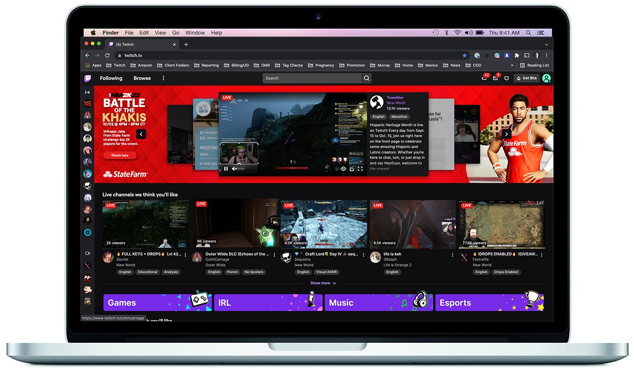 Laptop screen displaying the Twitch homepage with various live gaming streams, categories for Games, IRL, Music, and Esports, and a red banner promoting the Battle of the Khakis event.