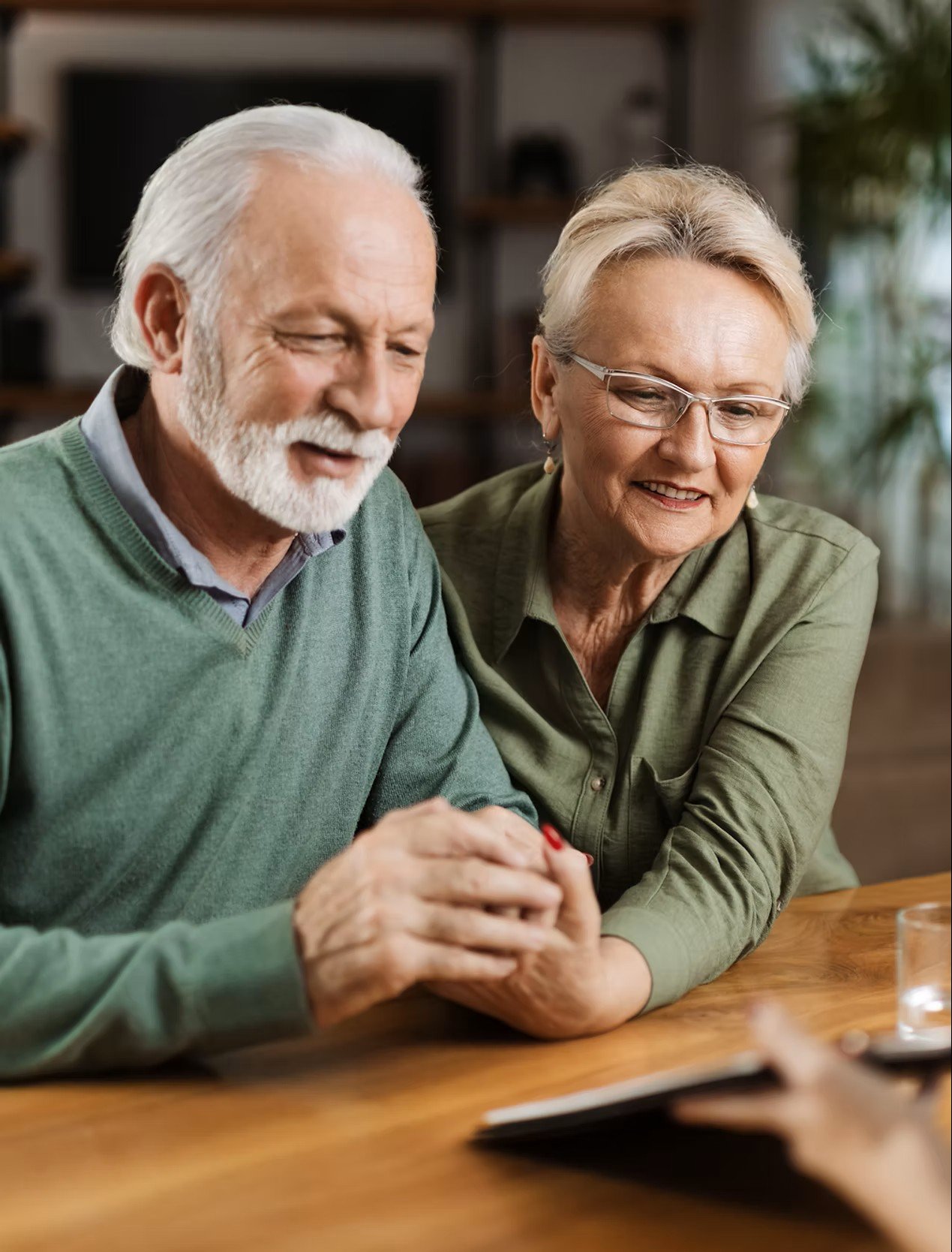 Senior couple in Grand Junction, Colorado discussing Medicare coverage options.