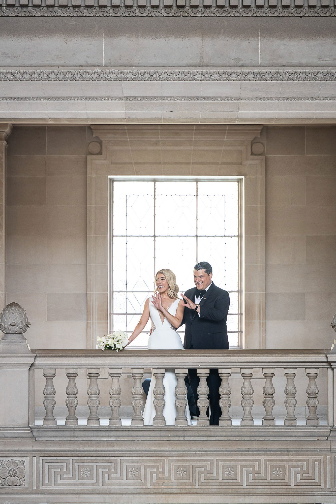 san-francisco-city-hall-wedding-couple-wave.jpg