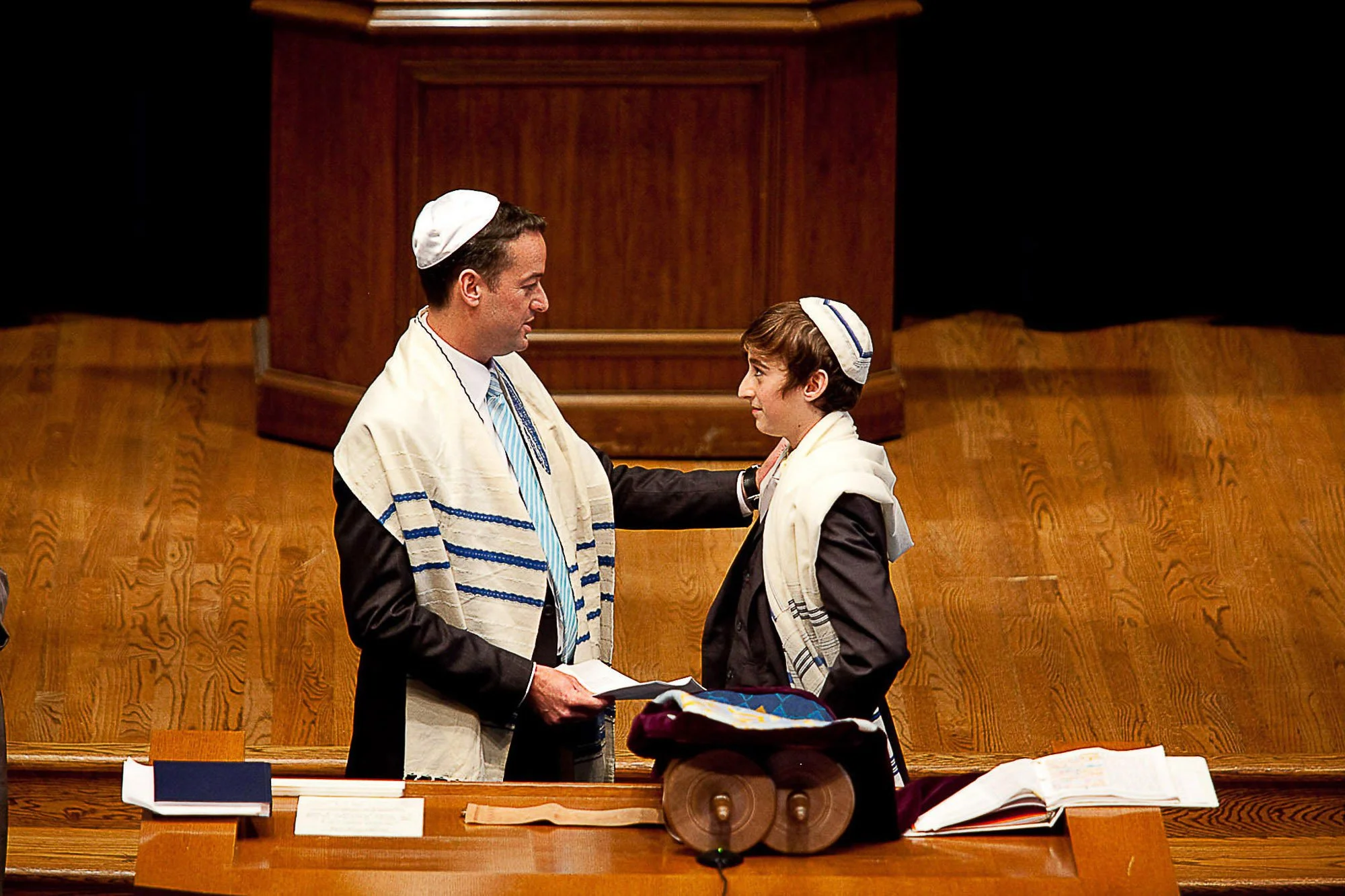 Father and son on the bimah during a bar mitzvah service