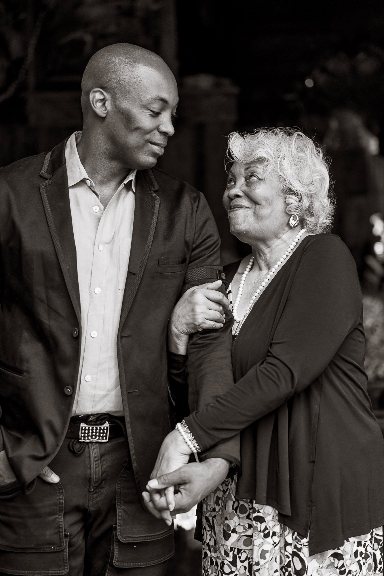 Son and his mother looking at each other, black and white