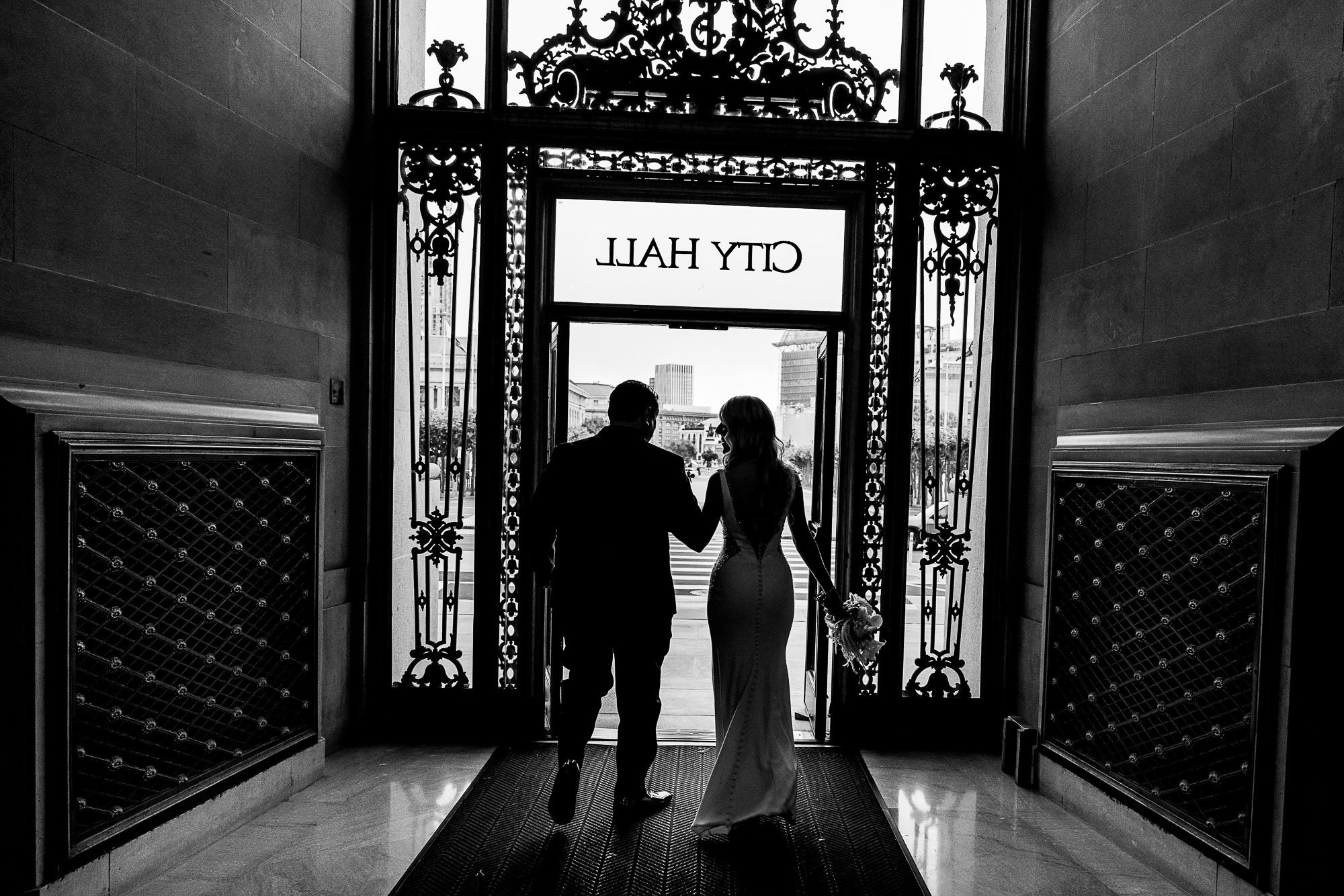 san-francisco-city-hall-wedding-bride-groom-portrait-exit.jpg