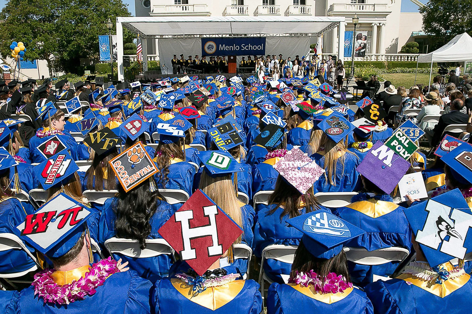 Menlo School graduates in decorated caps during the commencement ceremony