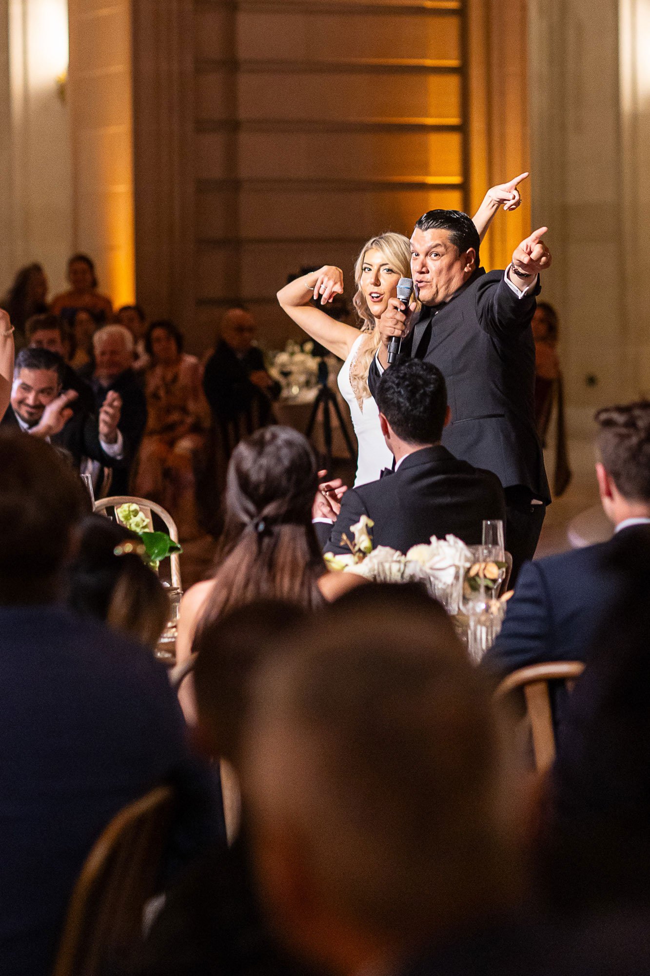 tara-arrowood-san-francisco-city-hall-wedding-reception-couple-cheer.jpg