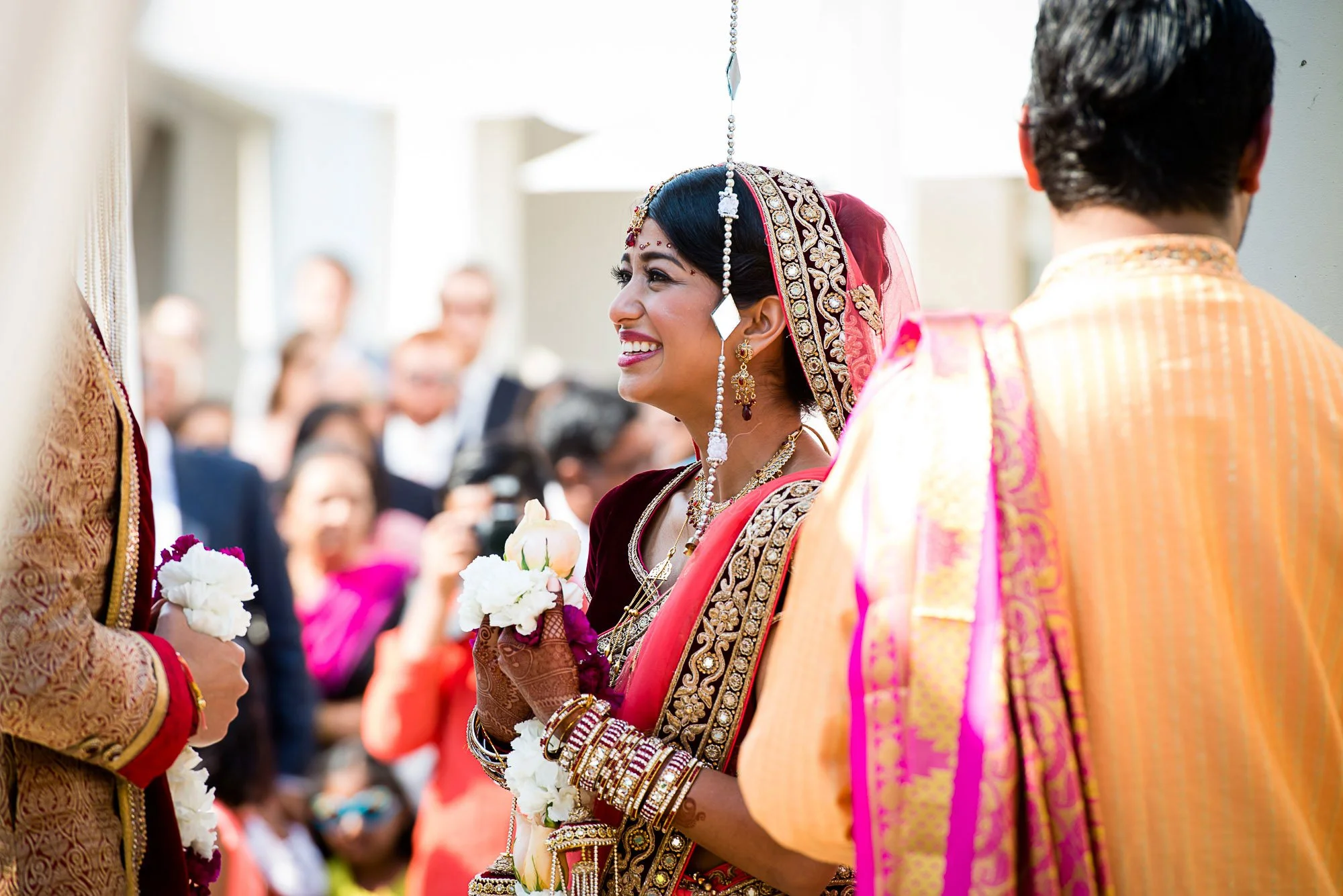 Bride laughing during the jaimala garland exchange