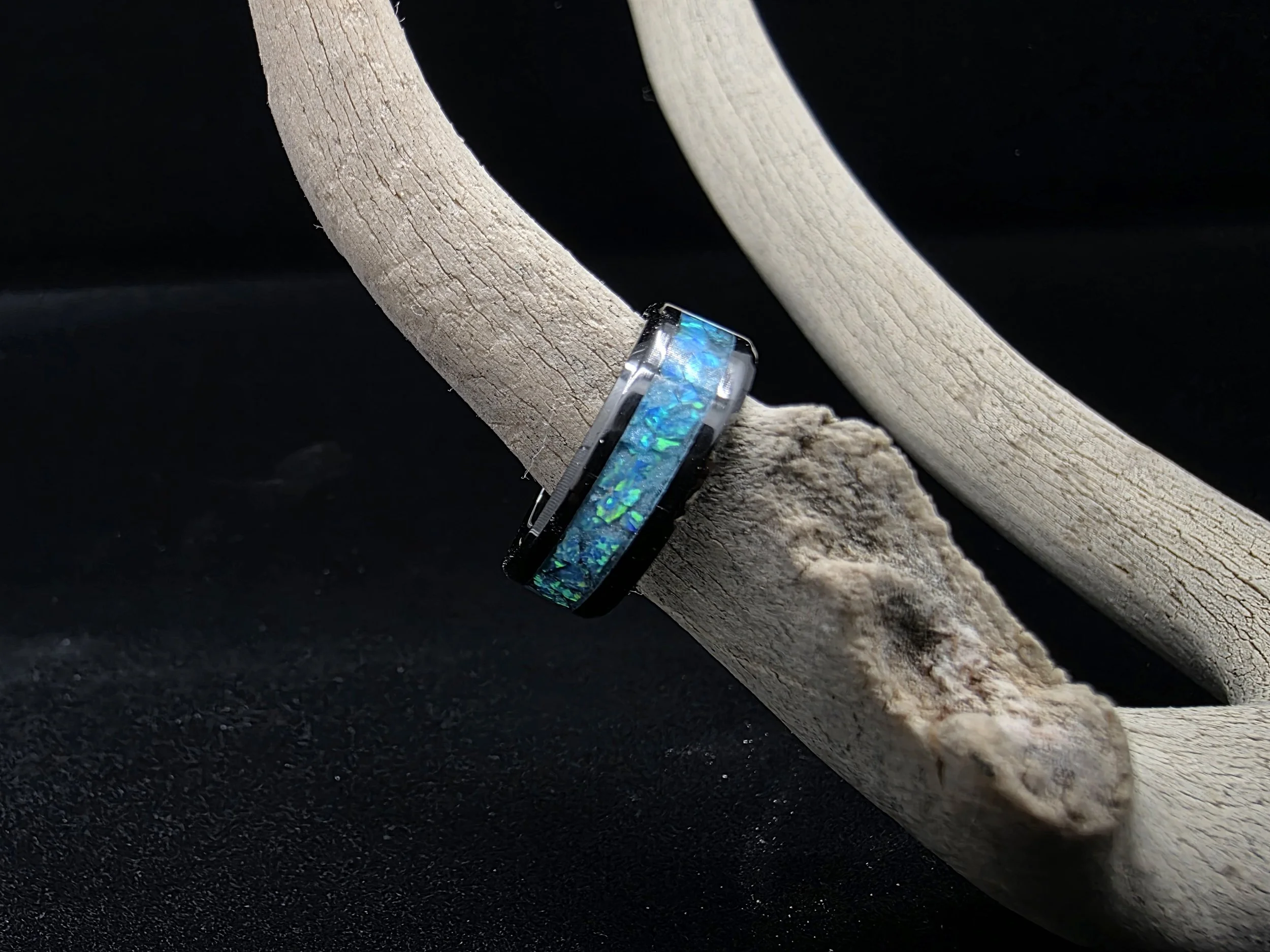 black ceramic ring with opal inlay