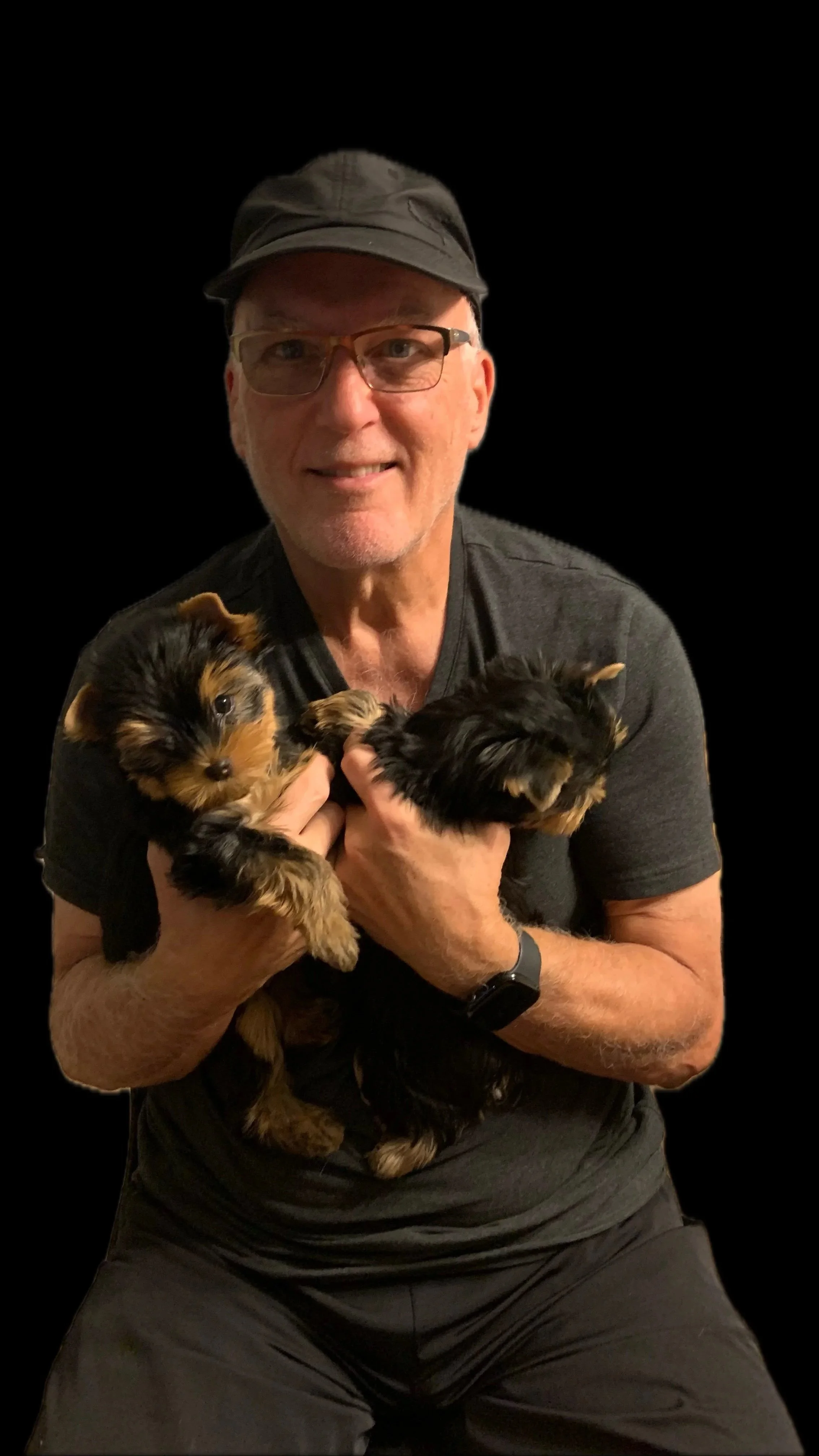 Mike holding two YORKSHIRE TERRIER Puppies at LuxTail Yorkies
