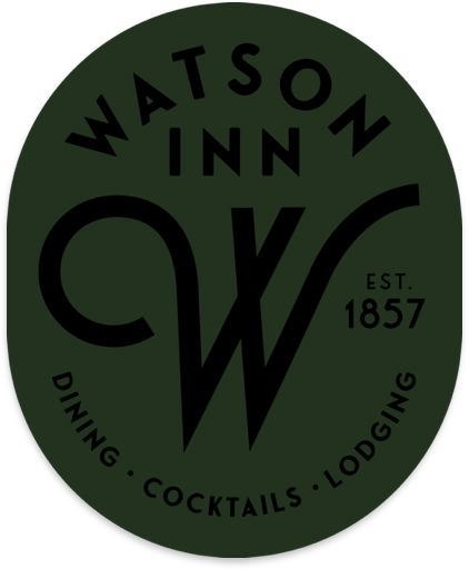 Green circular logo for Watson Inn with black text, featuring a stylized 'W' and 'C', and the words 'Dining', 'Cocktails', 'Lodging', and 'Est. 1857'.