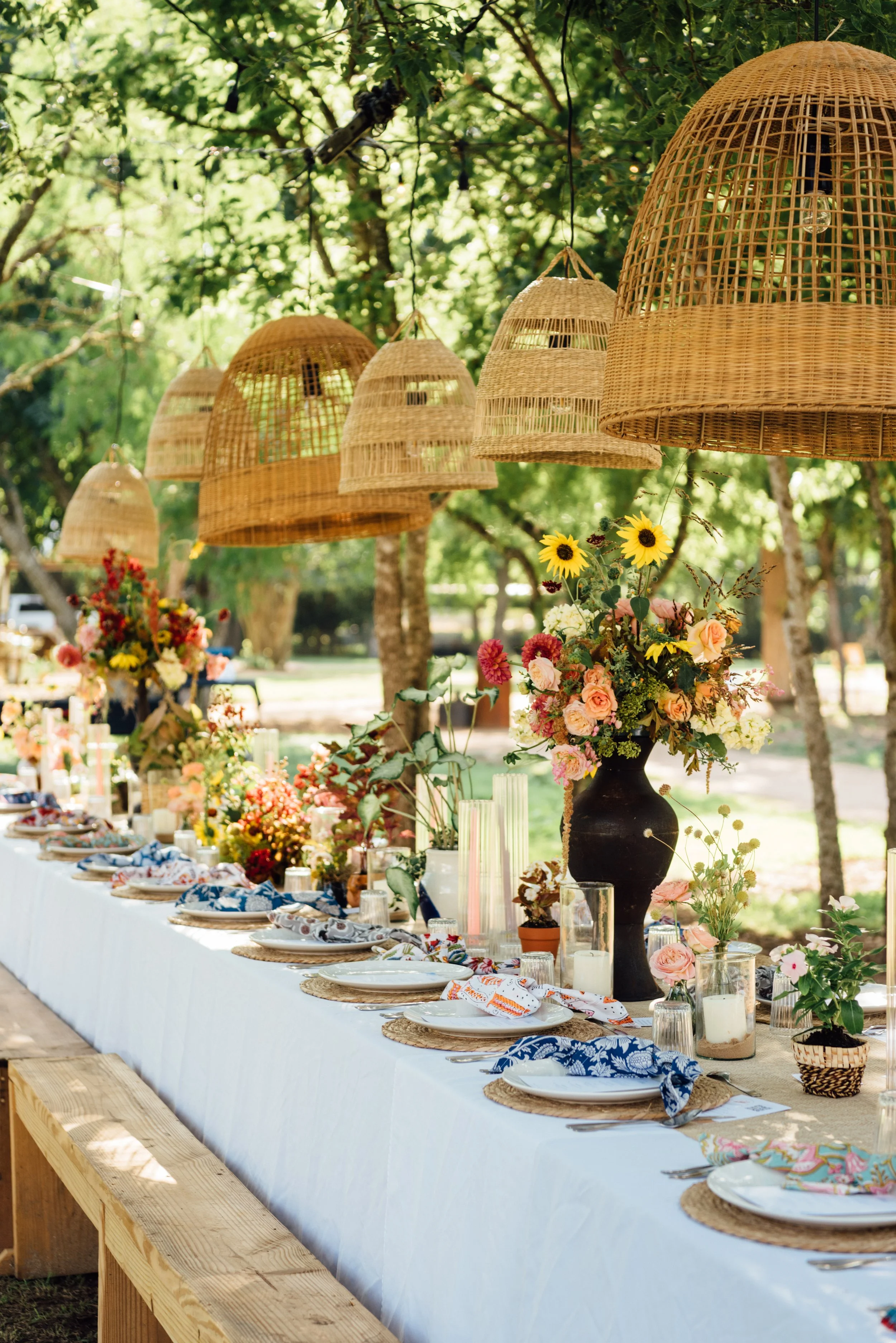 tablescape set for brand experience with florals and plates