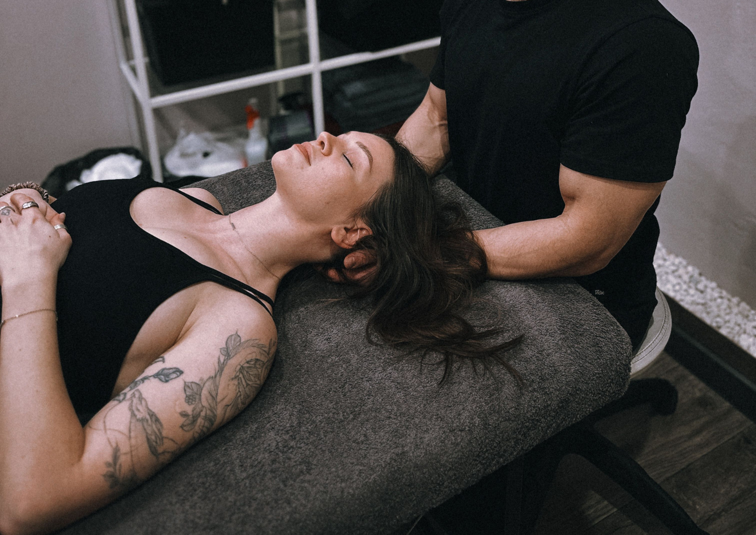 Physical therapist providing manual therapy during a one-on-one treatment session