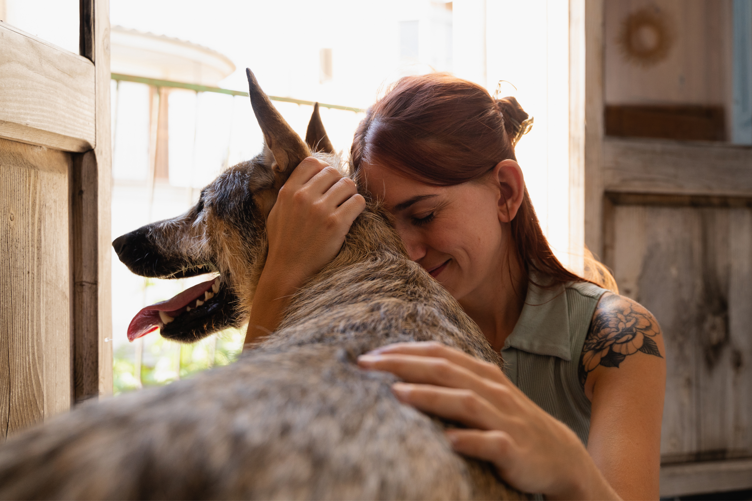 Woman and Dog Hugs
