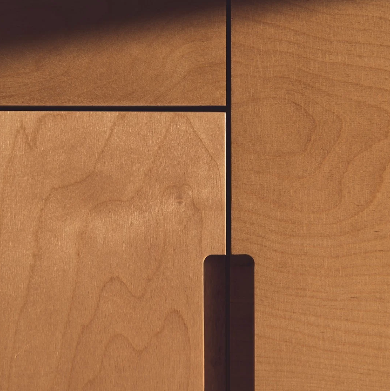 Close-up of a wooden billiard or pool table with specific markings and black dividers.