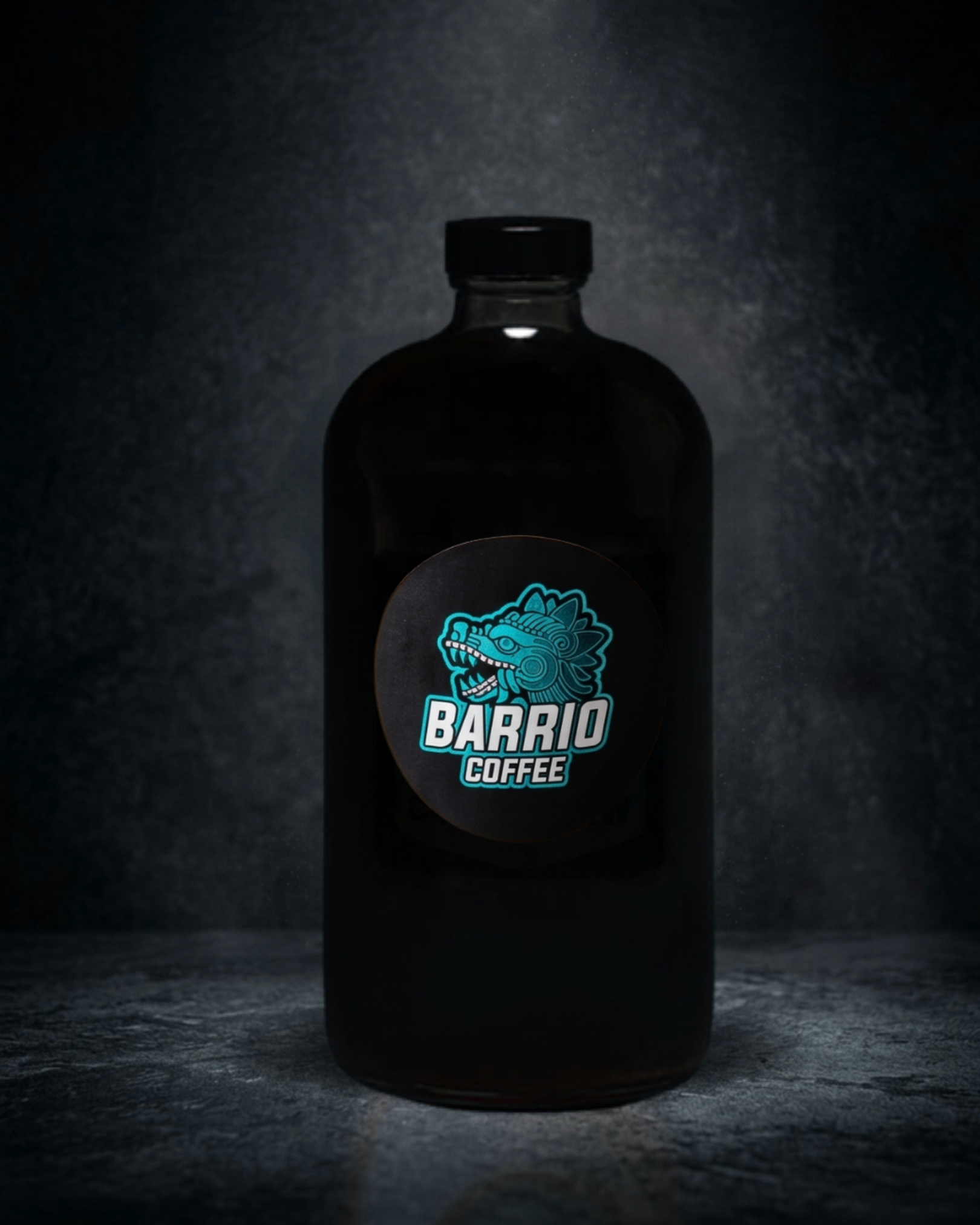Dark bottle with a colorful logo of a dragon and the text 'Barrio Coffee' in a dimly lit setting.