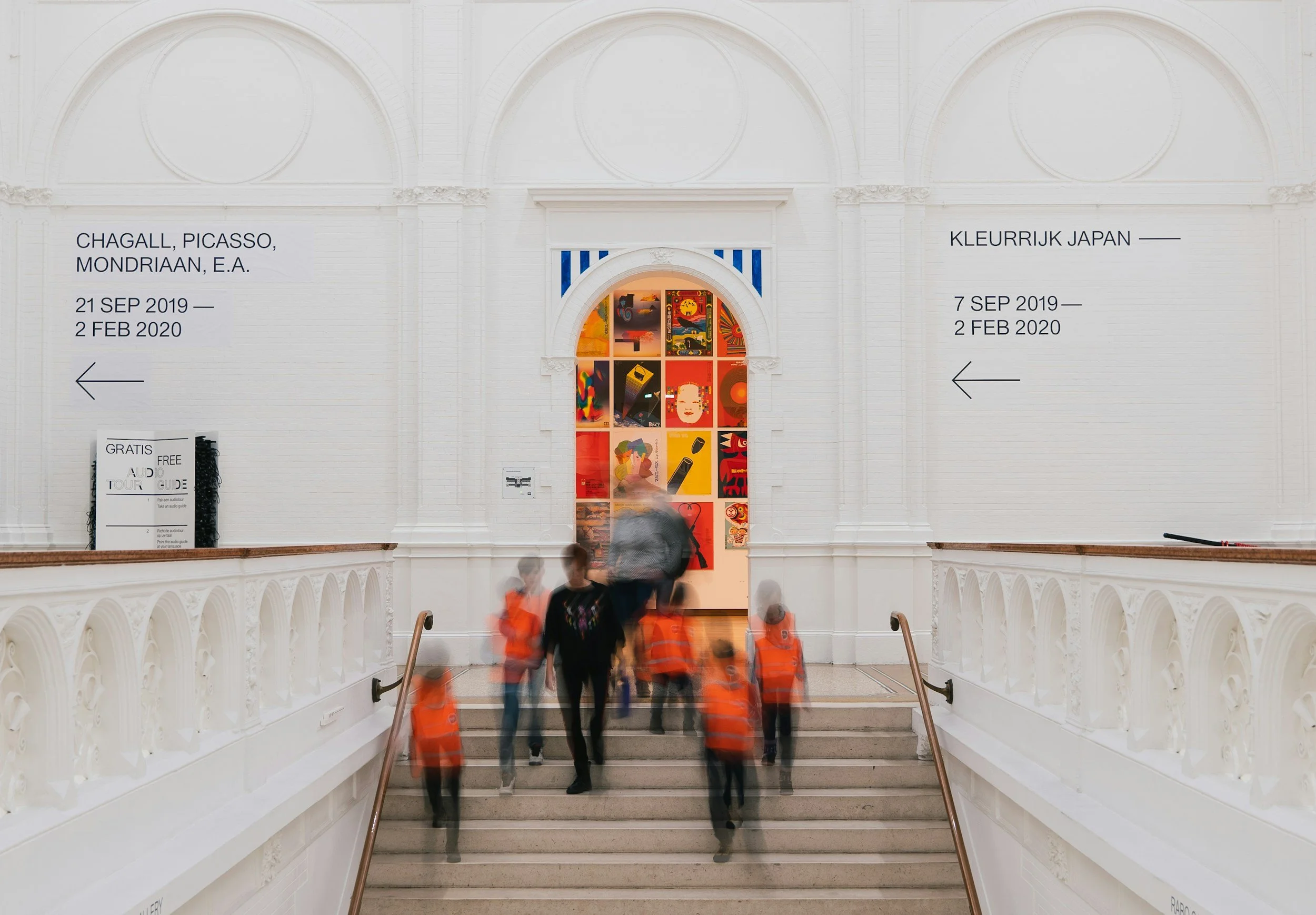 People approaching a museum gallery
