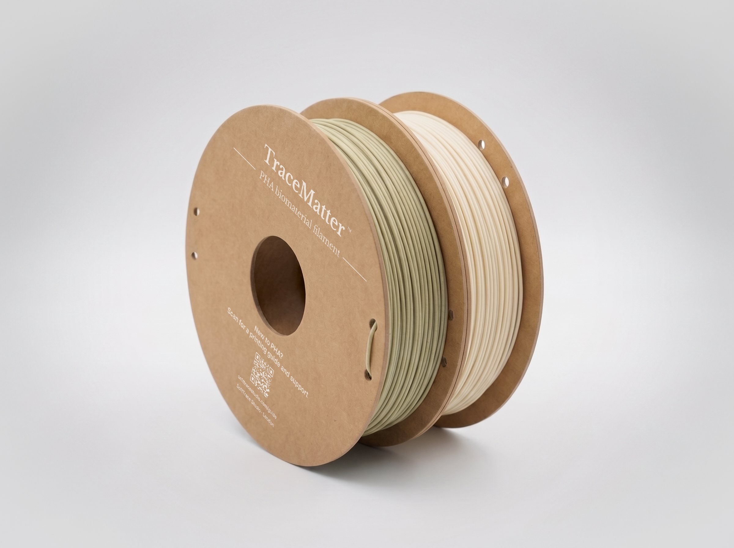 Spool of bioplastic filament labeled 'TraceMatters' for 3D printing, with a clean, minimalistic background.
