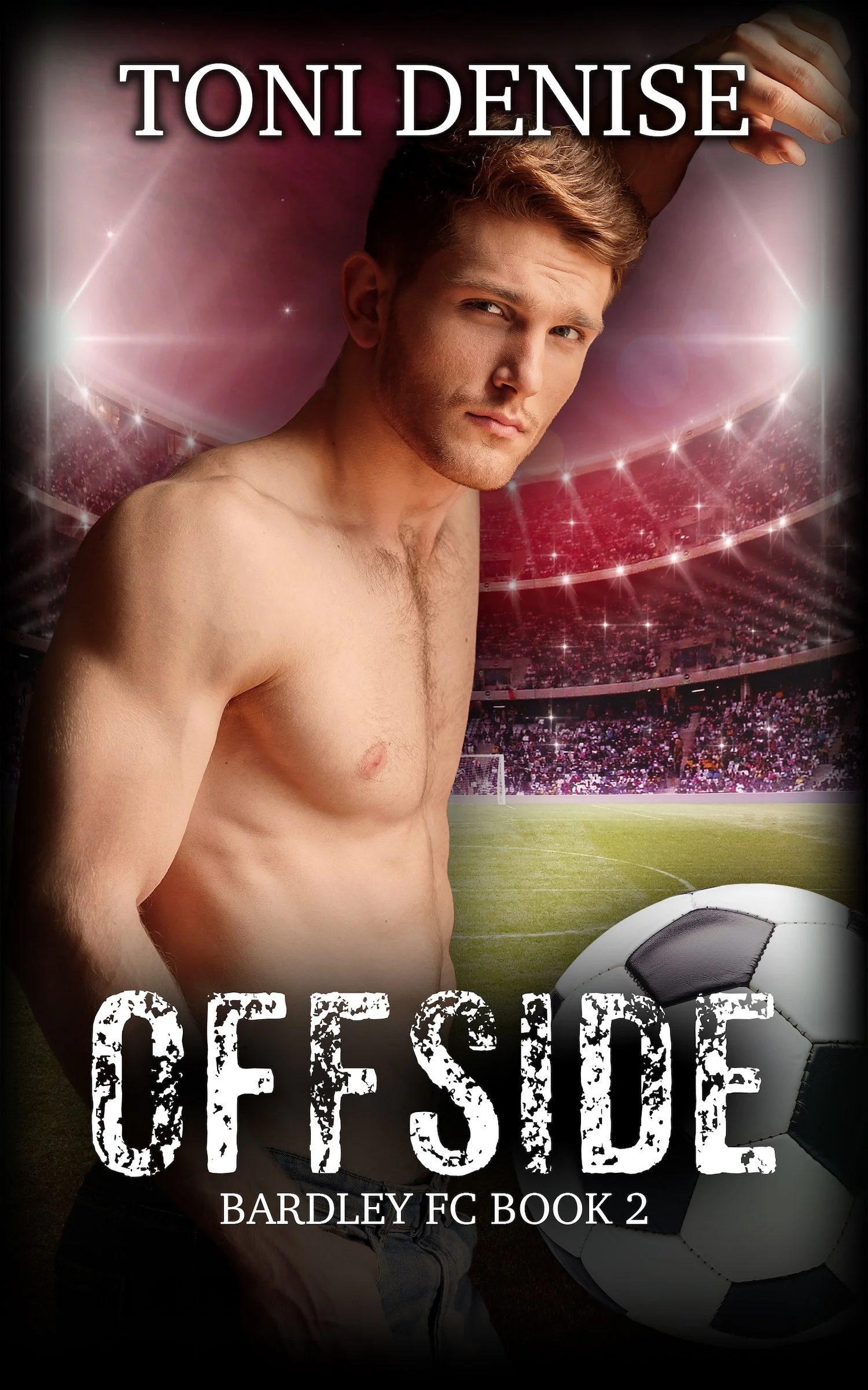 Book cover titled "Offside Bardley FC Book 2" featuring a shirtless young man with a serious expression, standing next to a soccer ball on a soccer field with a stadium background, bright lights and a pinkish sky.