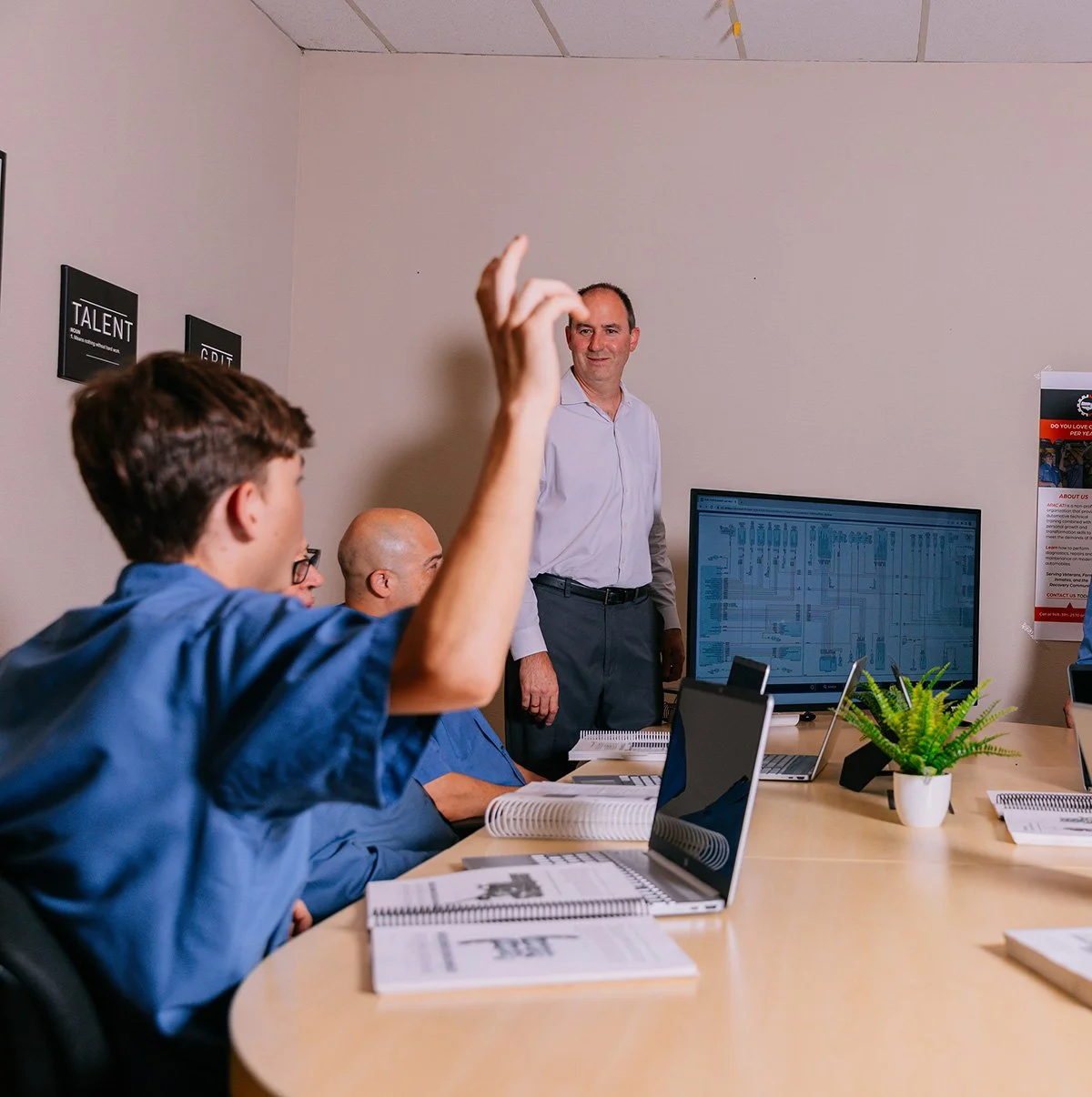Chris Knuth guiding his team in a conference room