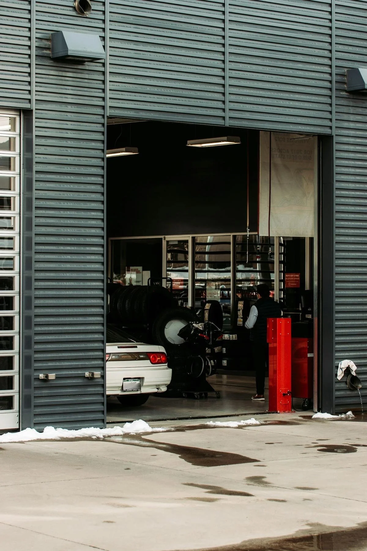 Open auto repair garage with cars inside