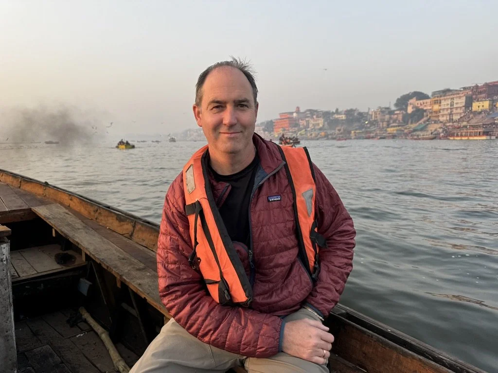Chris on a boat on water