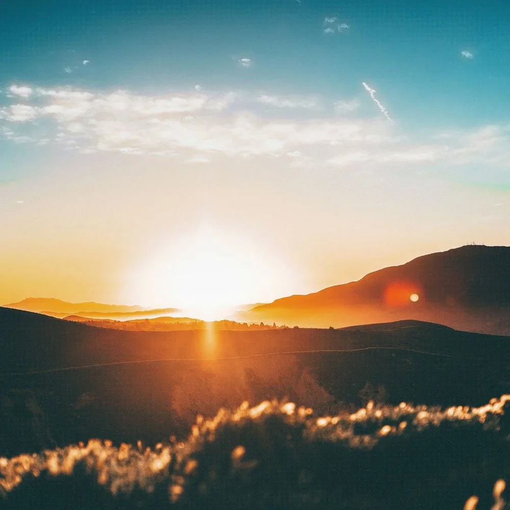 Sunset landscape over rolling hills