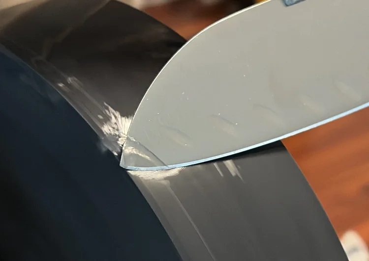 A chef's knife edge under the light