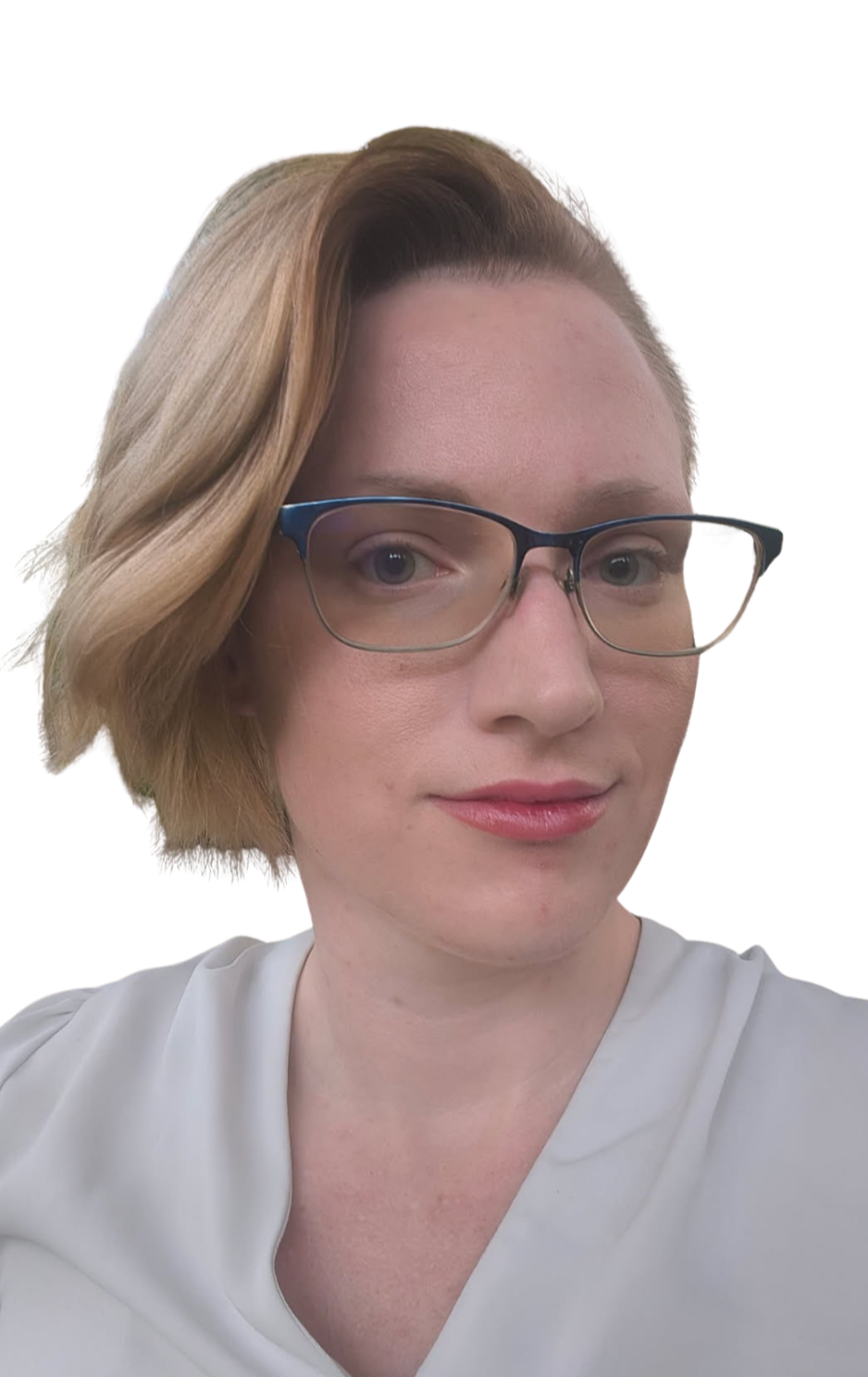 A woman with light skin, short wavy blonde hair, glasses with dark frames, and wearing a white top.
