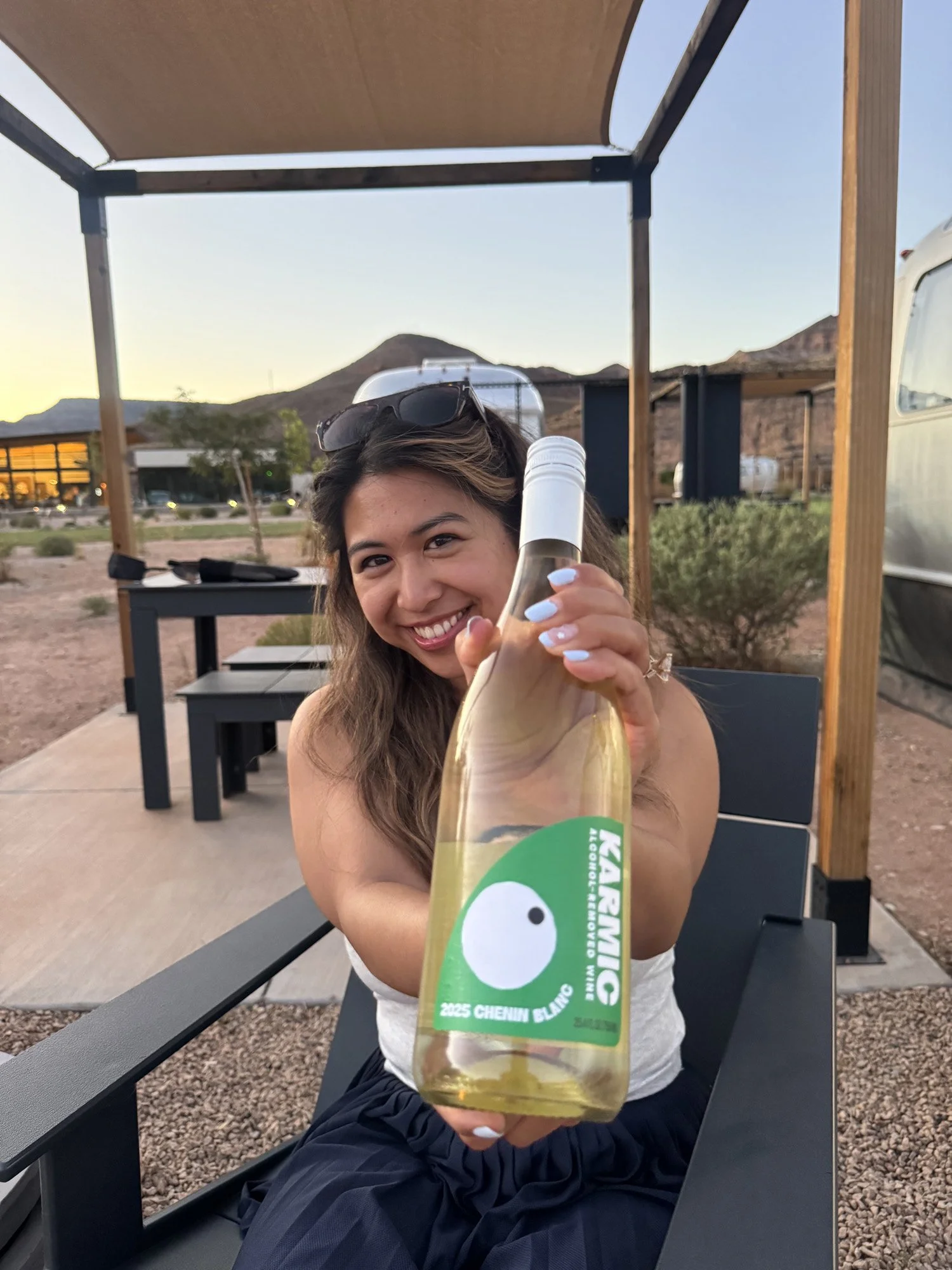 karmic-wine-woman-holding-bottle-airstream-camp-utah-06.jpg