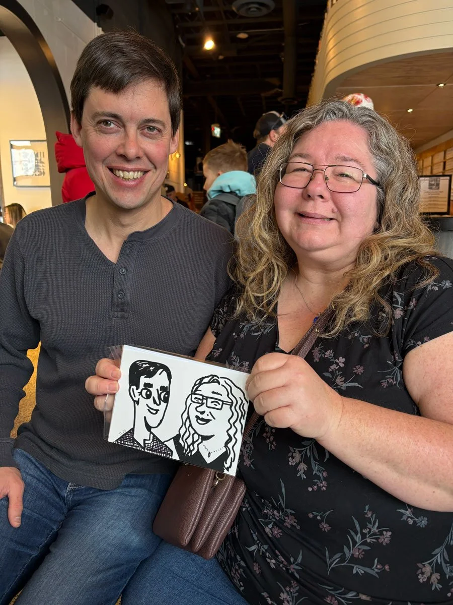 Event guests holding their couple derpy portrait. Both are satisfied with how they were captured. 