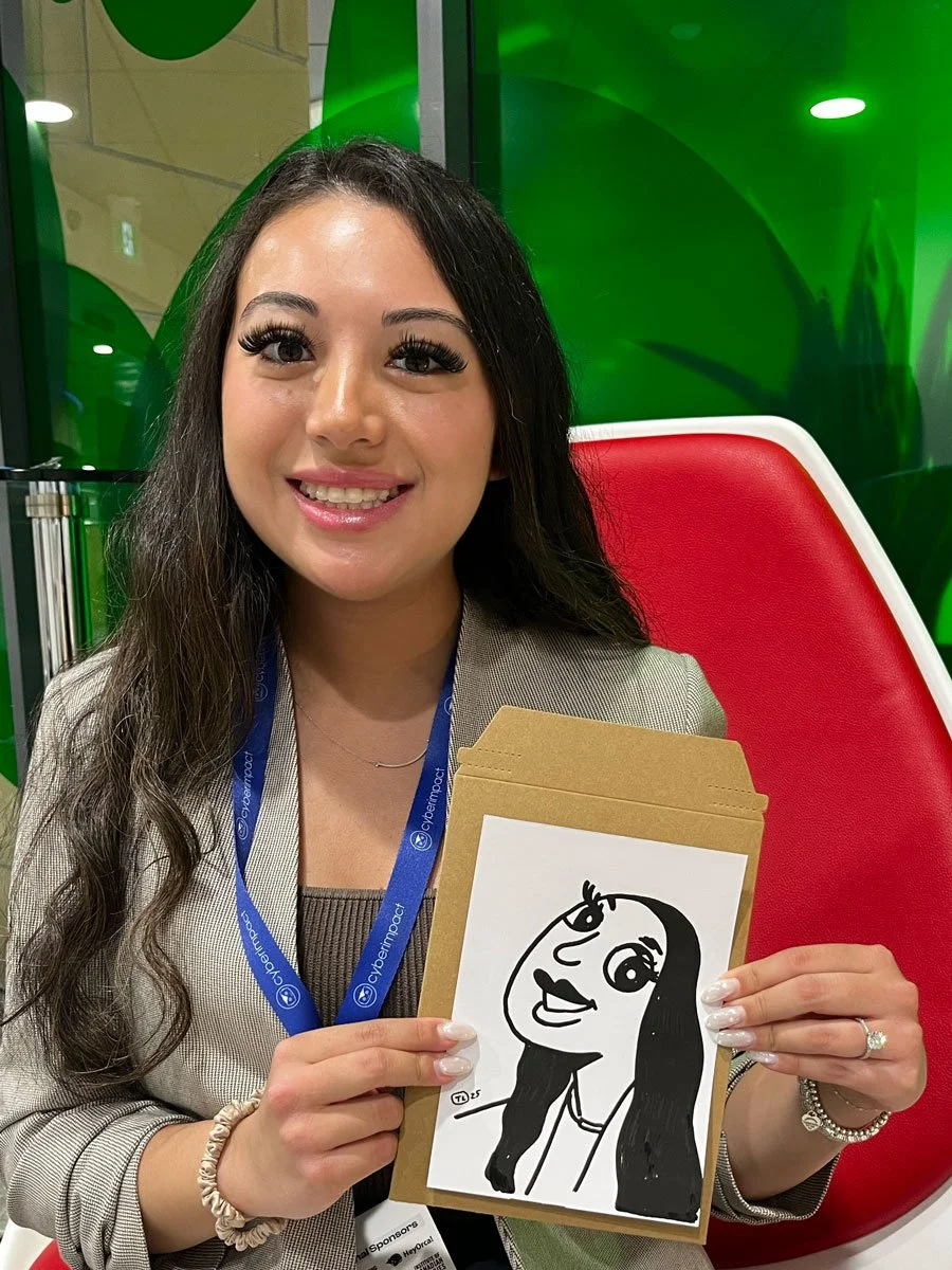 A woman with long black hair and large eyelashes holding her derpy portrait with beautiful nails
