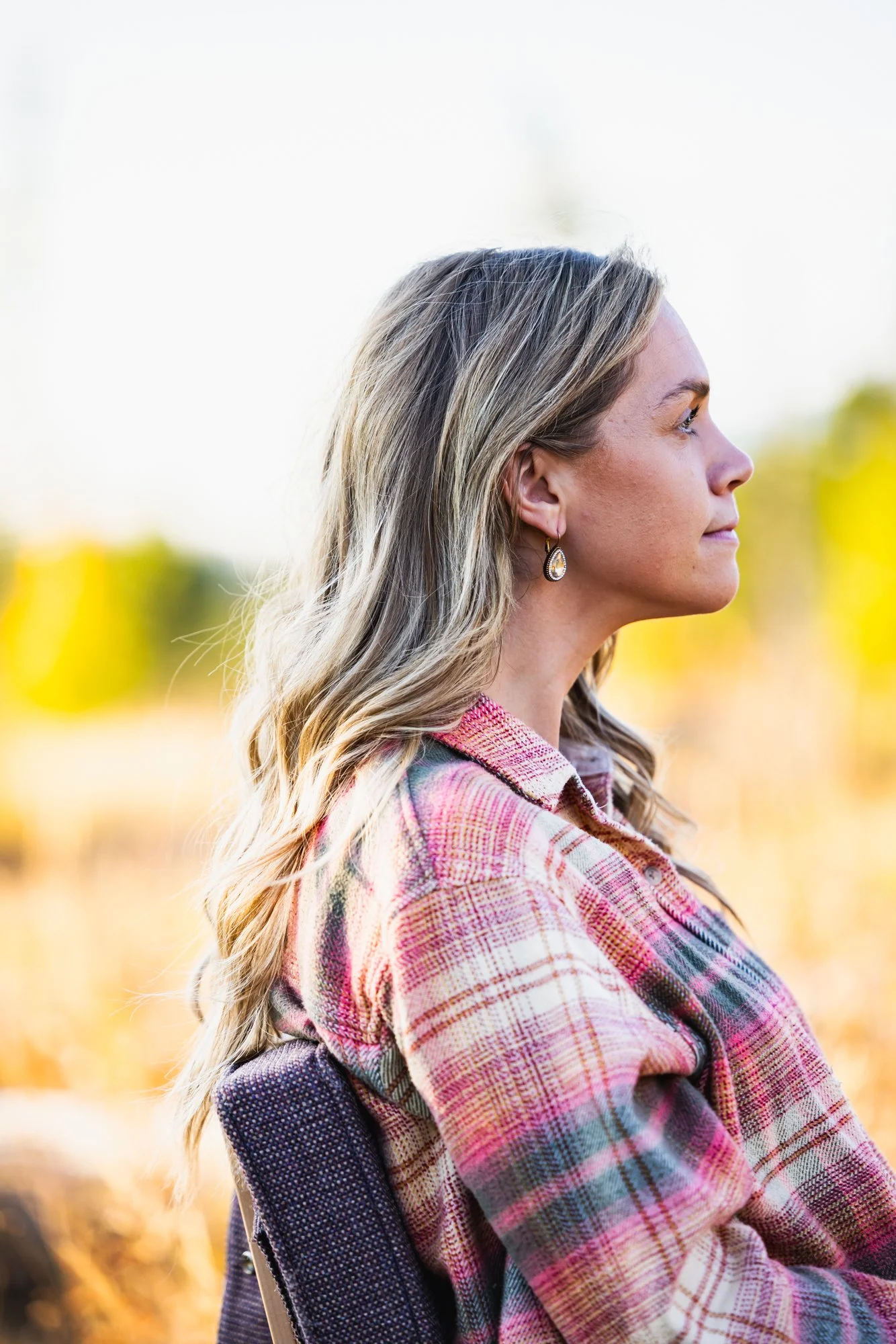 Dr. Jordan Fennelly demonstrating forward head posture that can cause neck pain, for her chiropractic practice, Two Sparrows Family Chiropractic in Whitefish, Montana