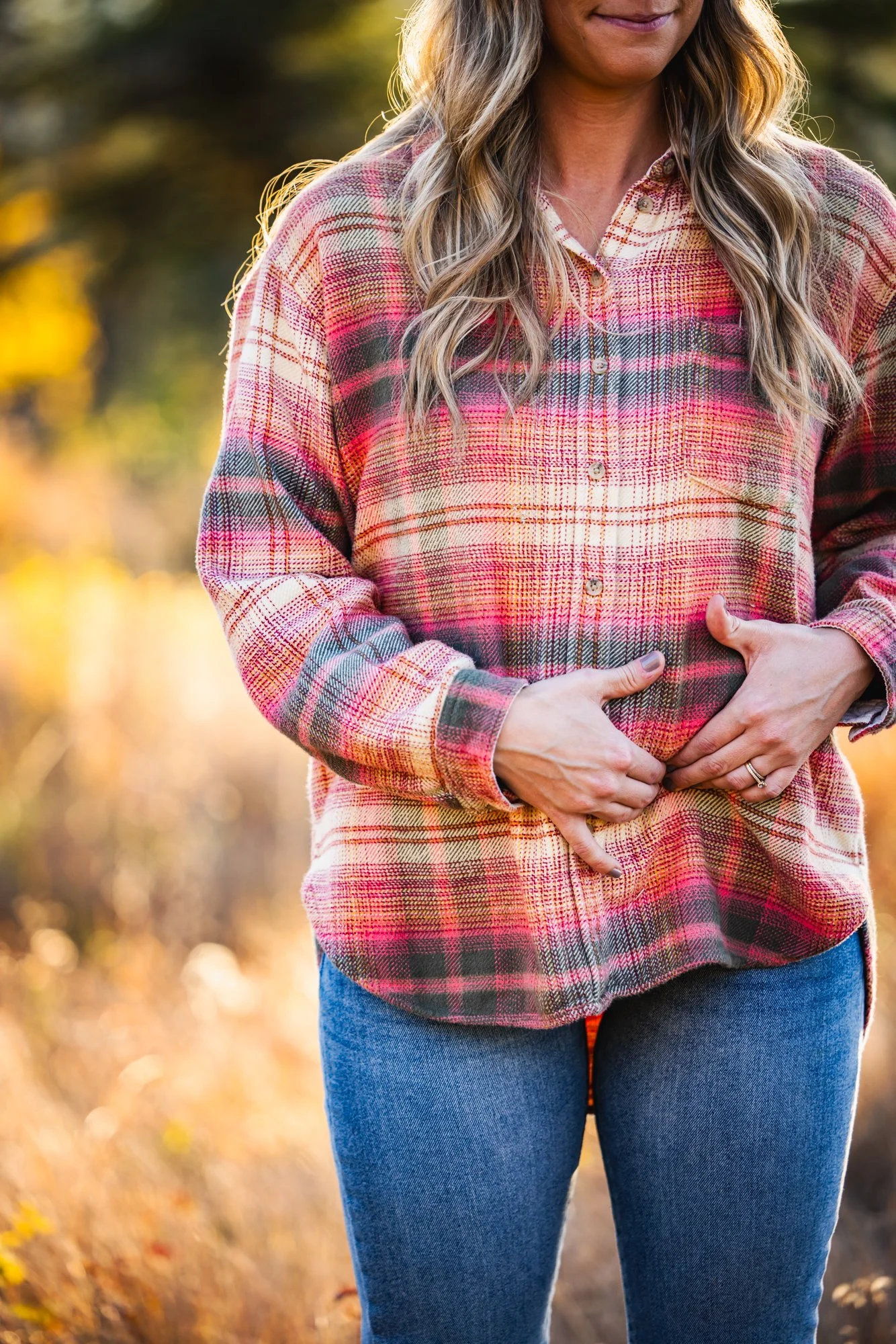 Dr. Jordan Fennelly of Two Sparrows Family Chiropractic in Whitefish, Montana touching the round ligament of the uterus, demonstrating the Webster's technique which is used on pregnant patients during a chiropractic adjustment.