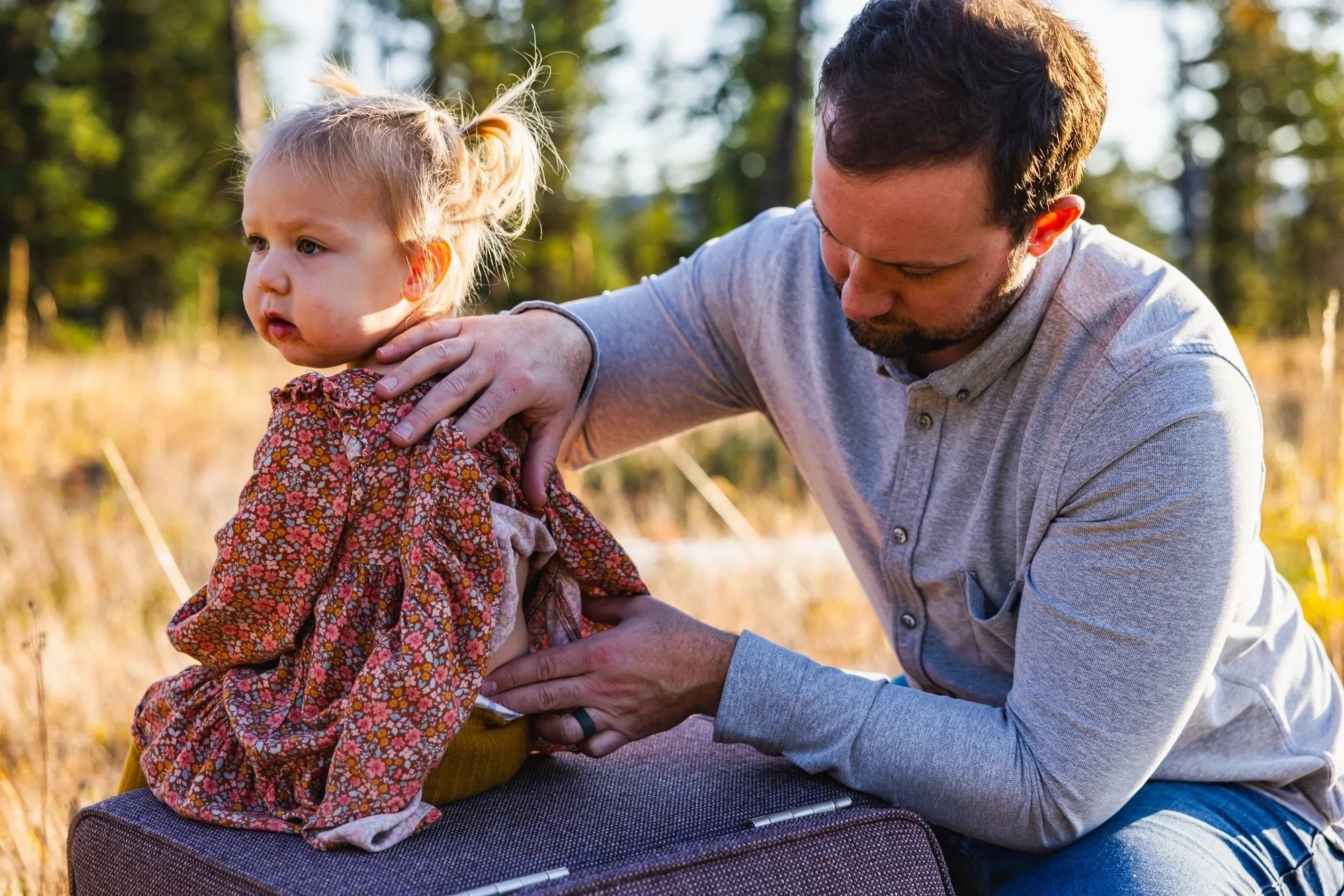 Dr. Peter Fennelly analyzing a pediatric patient's spine before the chiropractic adjustment 