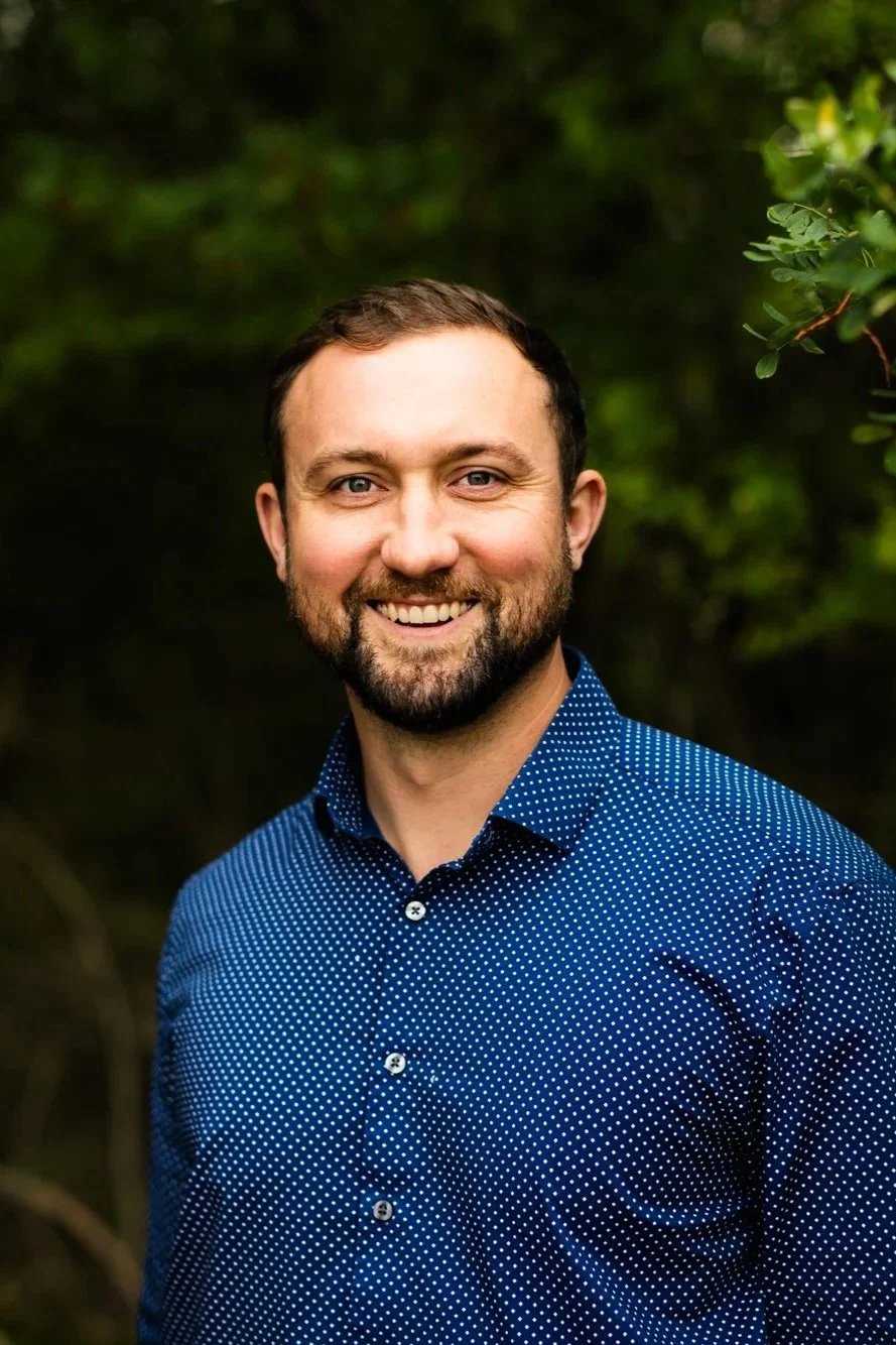 Dr. Peter Fennelly standing by his chiropractic practice, Two Sparrows Family Chiropractic in Whitefish, Montana
