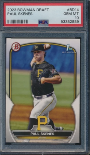 2023 Bowman Draft baseball card of Paul Skenes with PSA grading, featuring a photograph of him in a baseball uniform on the field, holding a baseball. The card has a red border with a PSA label at the top indicating grade GEM MT 10.