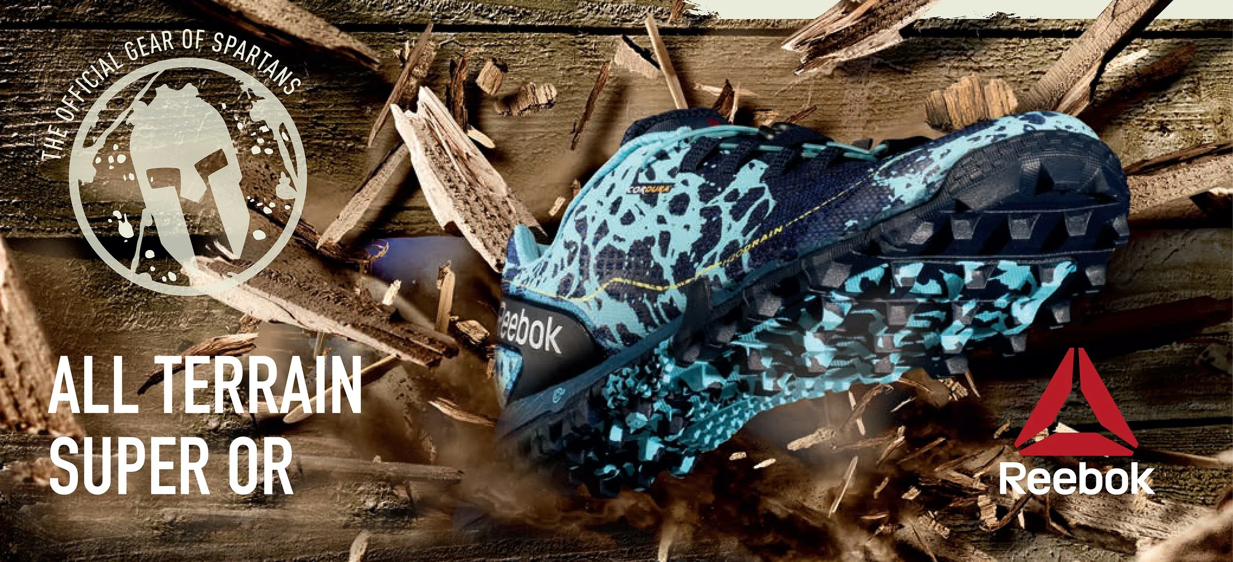 A blue and black Reebok all-terrain trail running shoe on a fallen wooden log with dirt and wood debris around, promotional image for Reebok's all-terrain shoes.