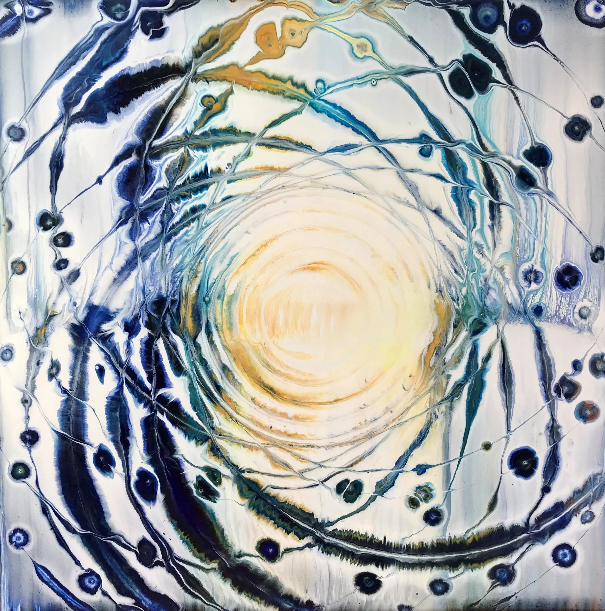 An abstract painting with swirling patterns in shades of blue, black, white, and touches of yellow and green, creating a cosmic or galaxy-like appearance.