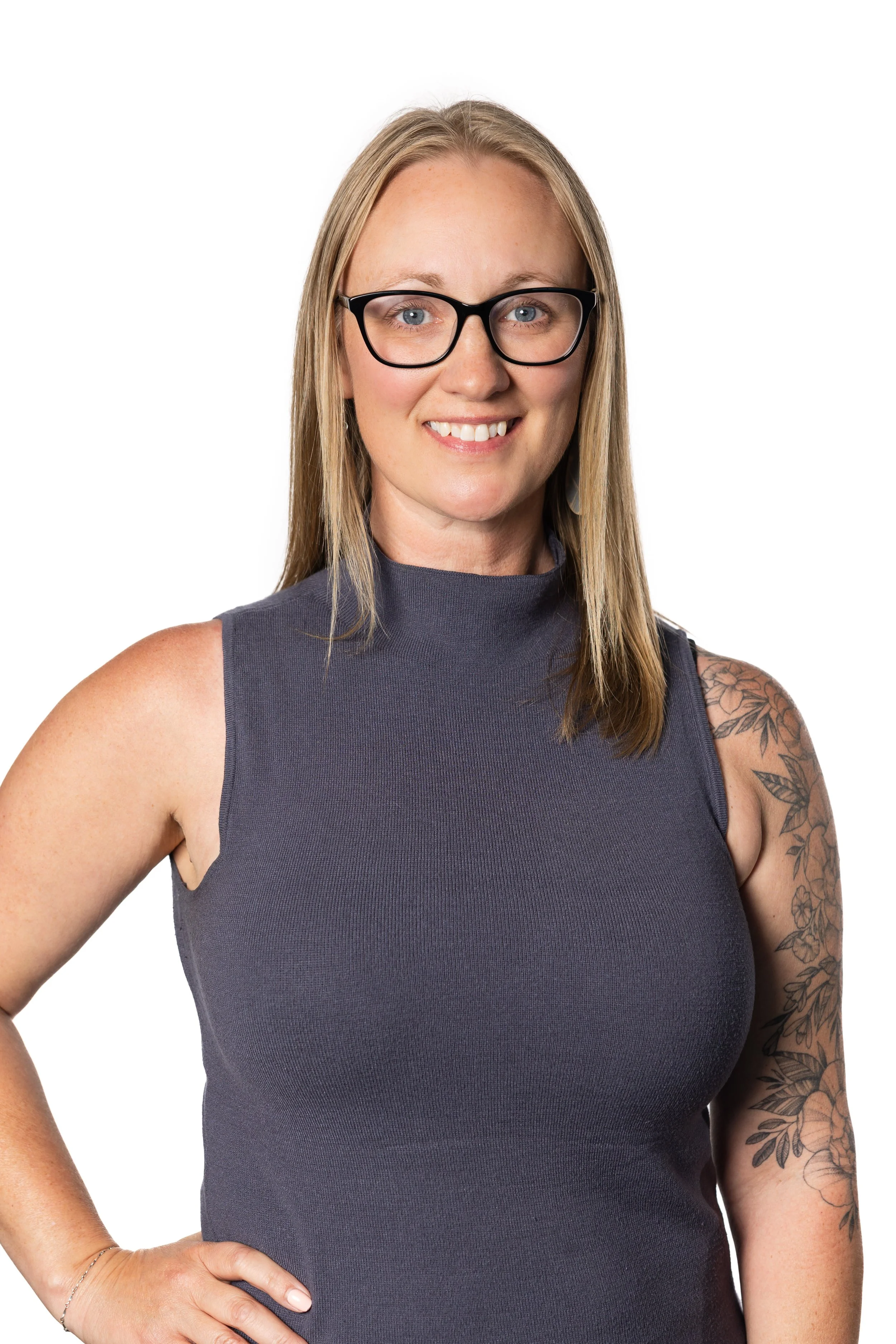 Dr. Jen Mimish, midlife women's health nurse practitioner, blonde woman with glasses smiling