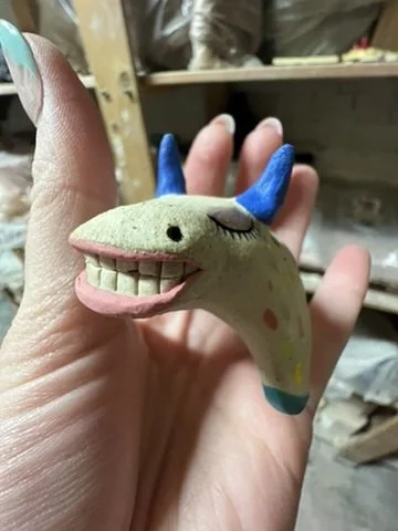 toothy cow figure