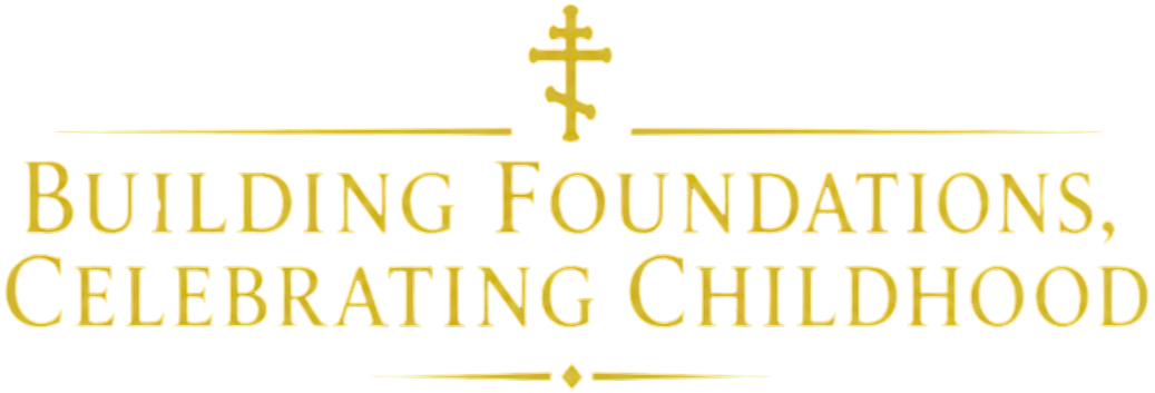 Gold text on black background reads, 'Building Foundations, Celebrating Childhood' with a decorative cross and lines above and below the text.
