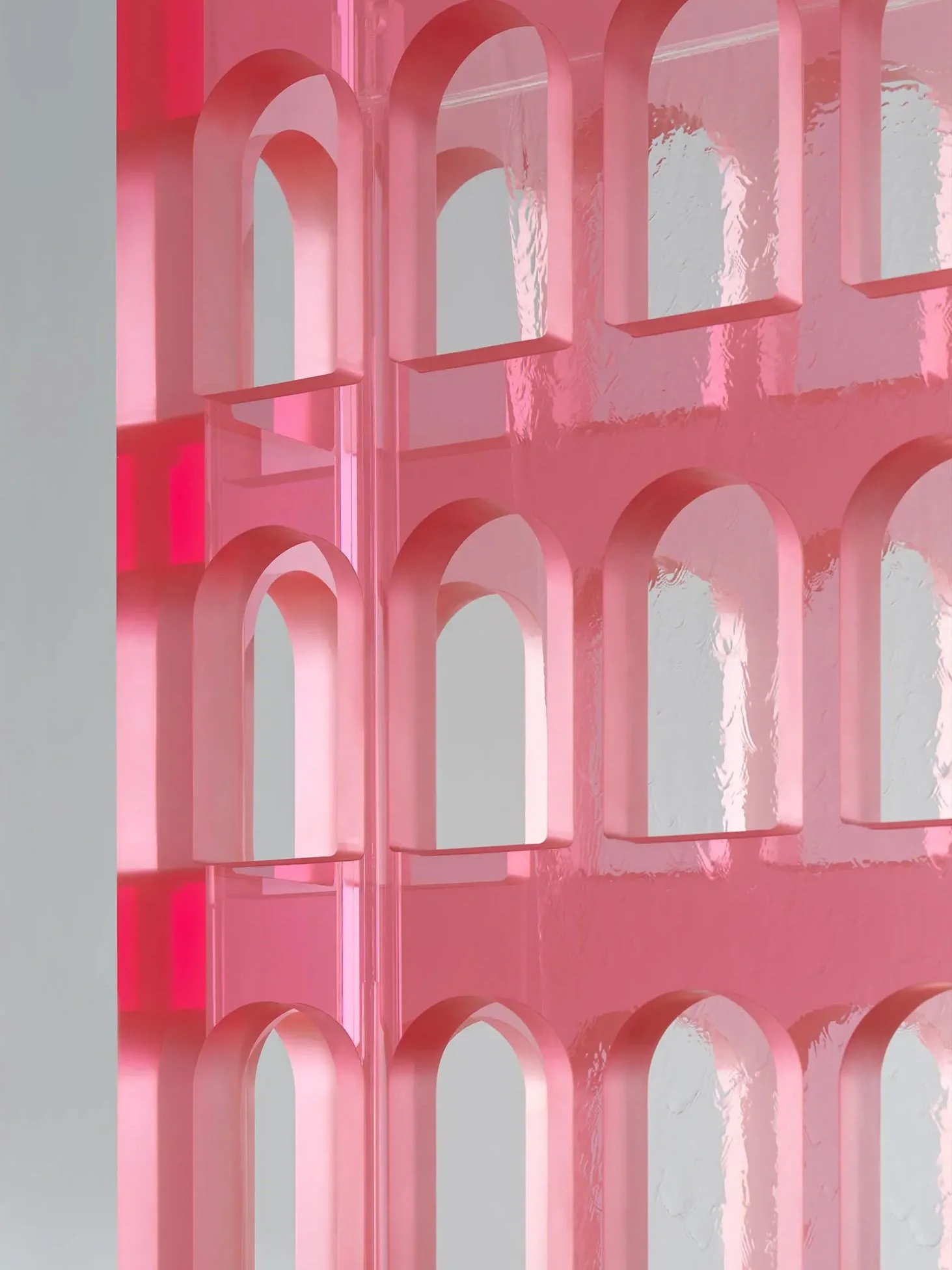 Close-up of a pink plastic container with multiple circular and arched cutouts arranged in a repeating pattern.