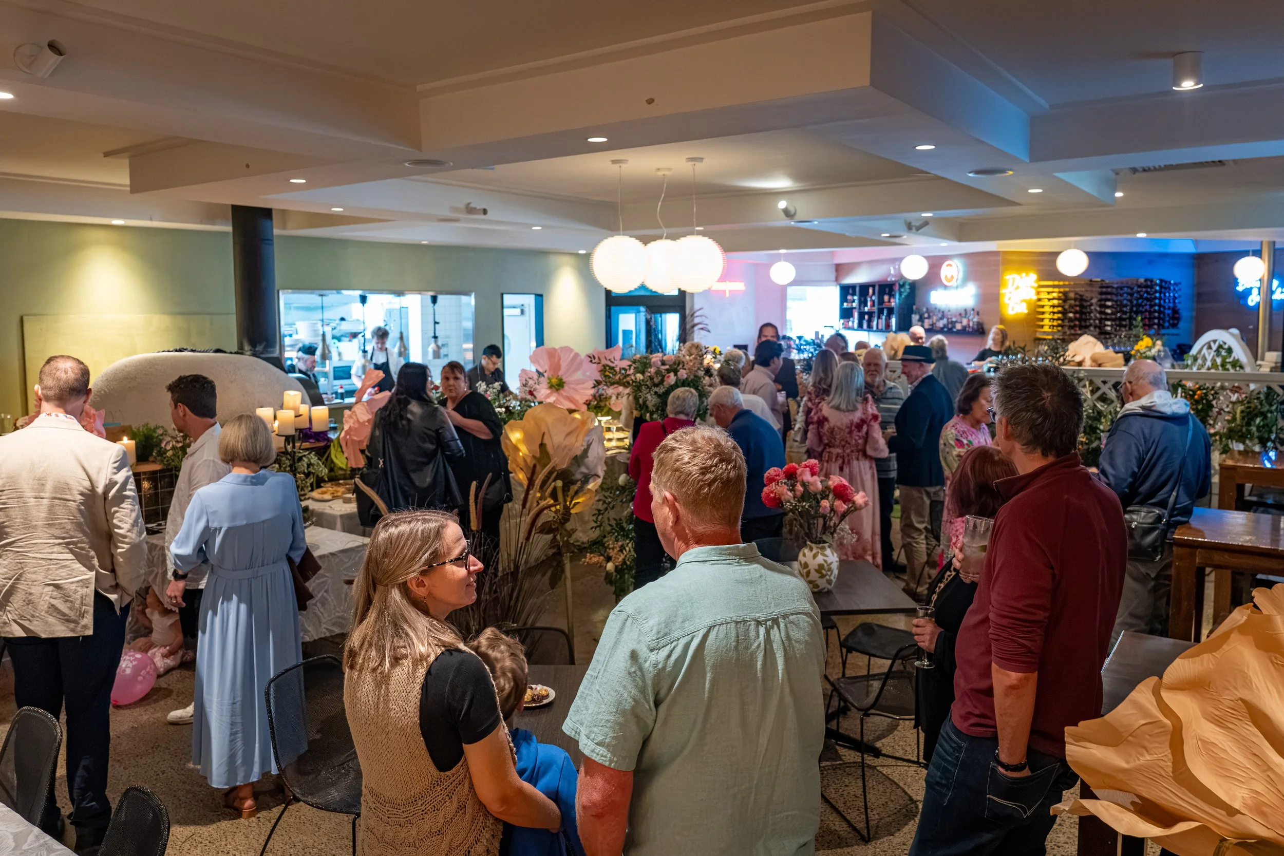 Photo of guests enjoying themselves at a birthday celebration in a pub