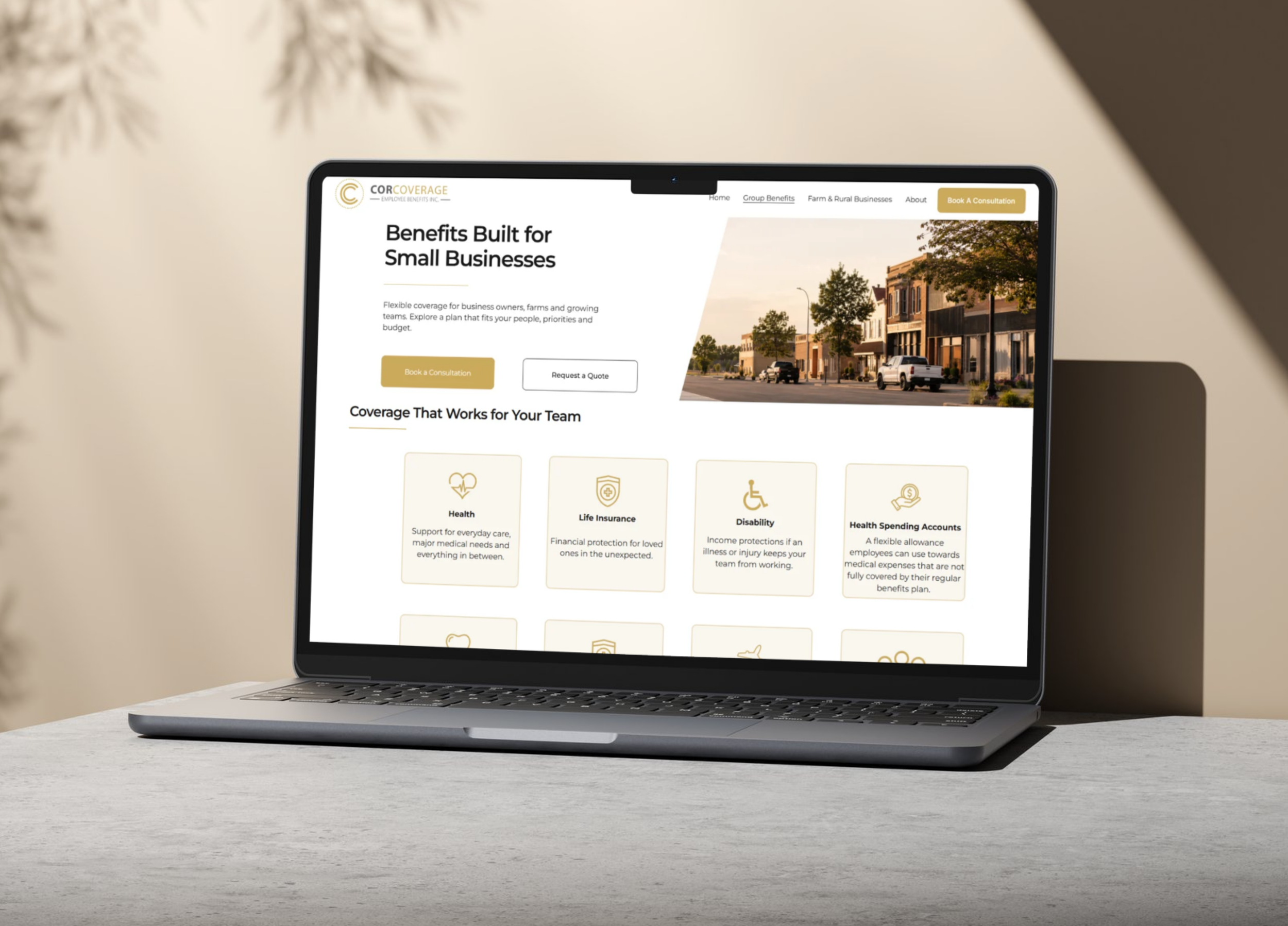Laptop on desk displaying a website for small business