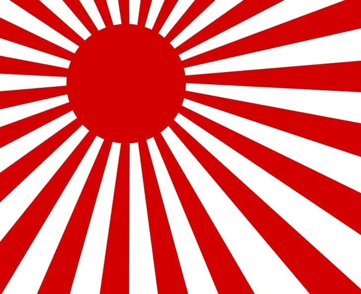 Red and white radiating stripes design with a large red circle in the center.