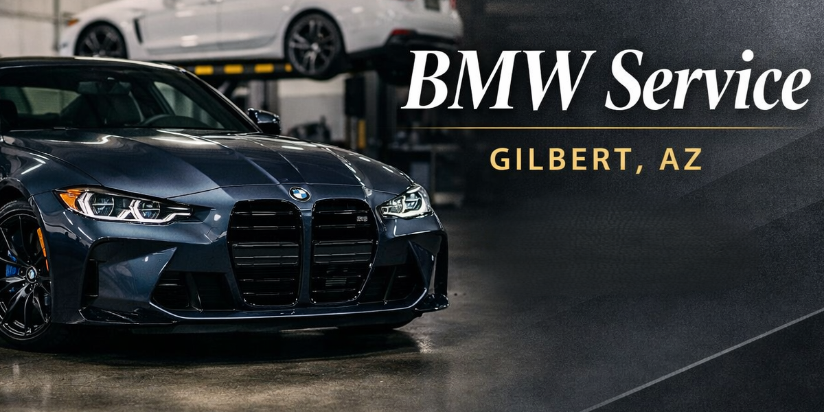 A dark gray BMW car parked in a garage with a white car on a lift in the background. The image features the text 'BMW Service Gilbert, AZ'.