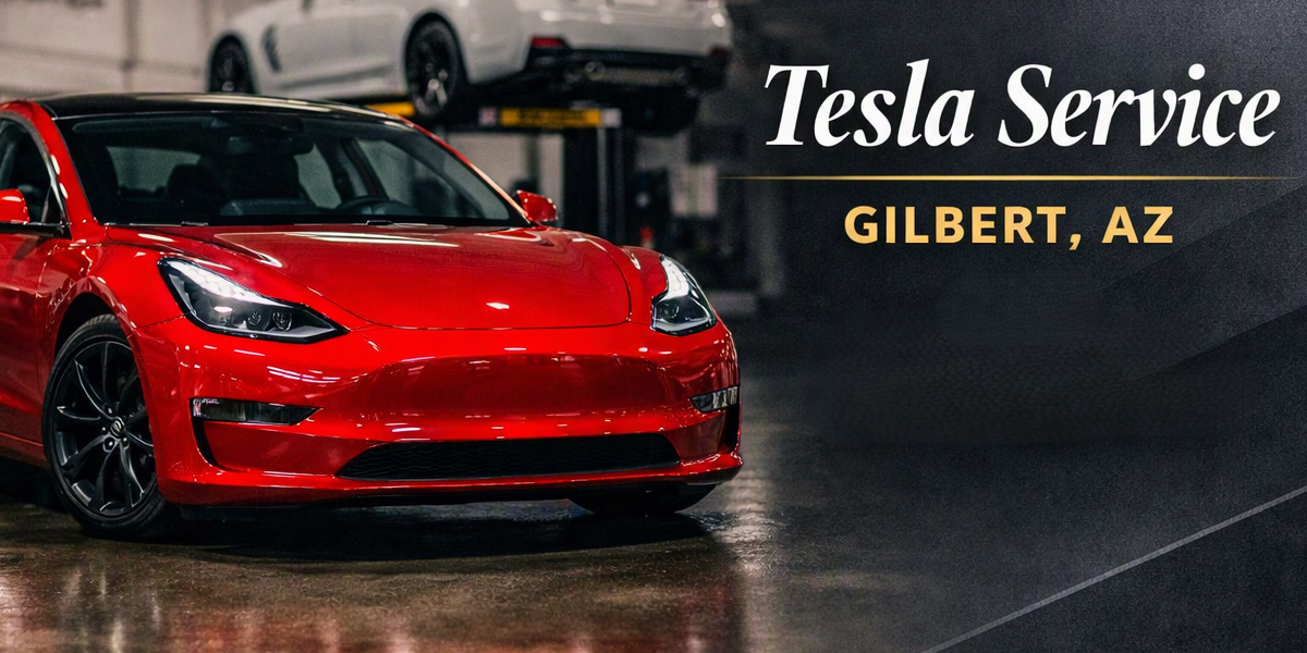 A red Tesla car parked inside a garage for service, with a white vehicle on a lift in the background, and text overlay reading 'Tesla Service Gilbert, AZ'.