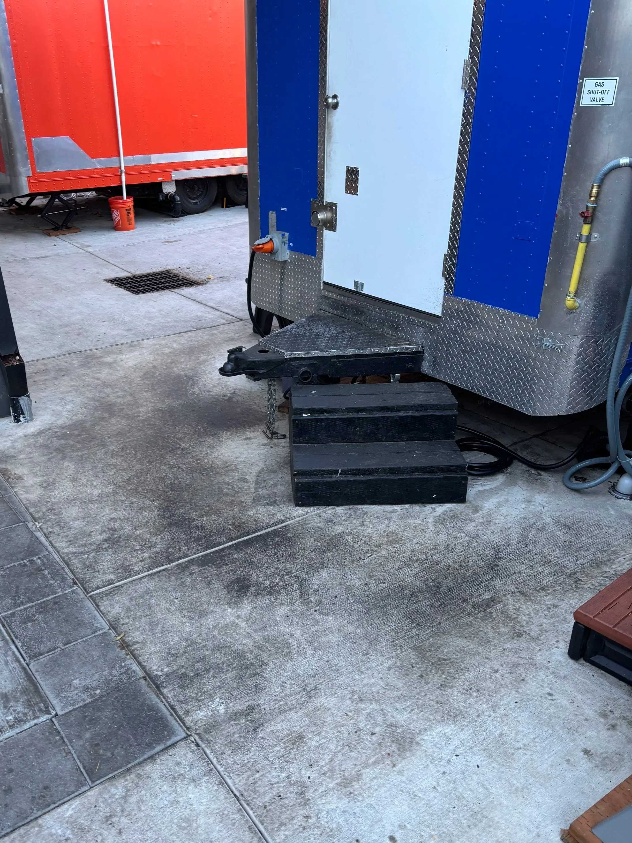 Grease behind food cart before degreaser and high volume rinse, Portland.